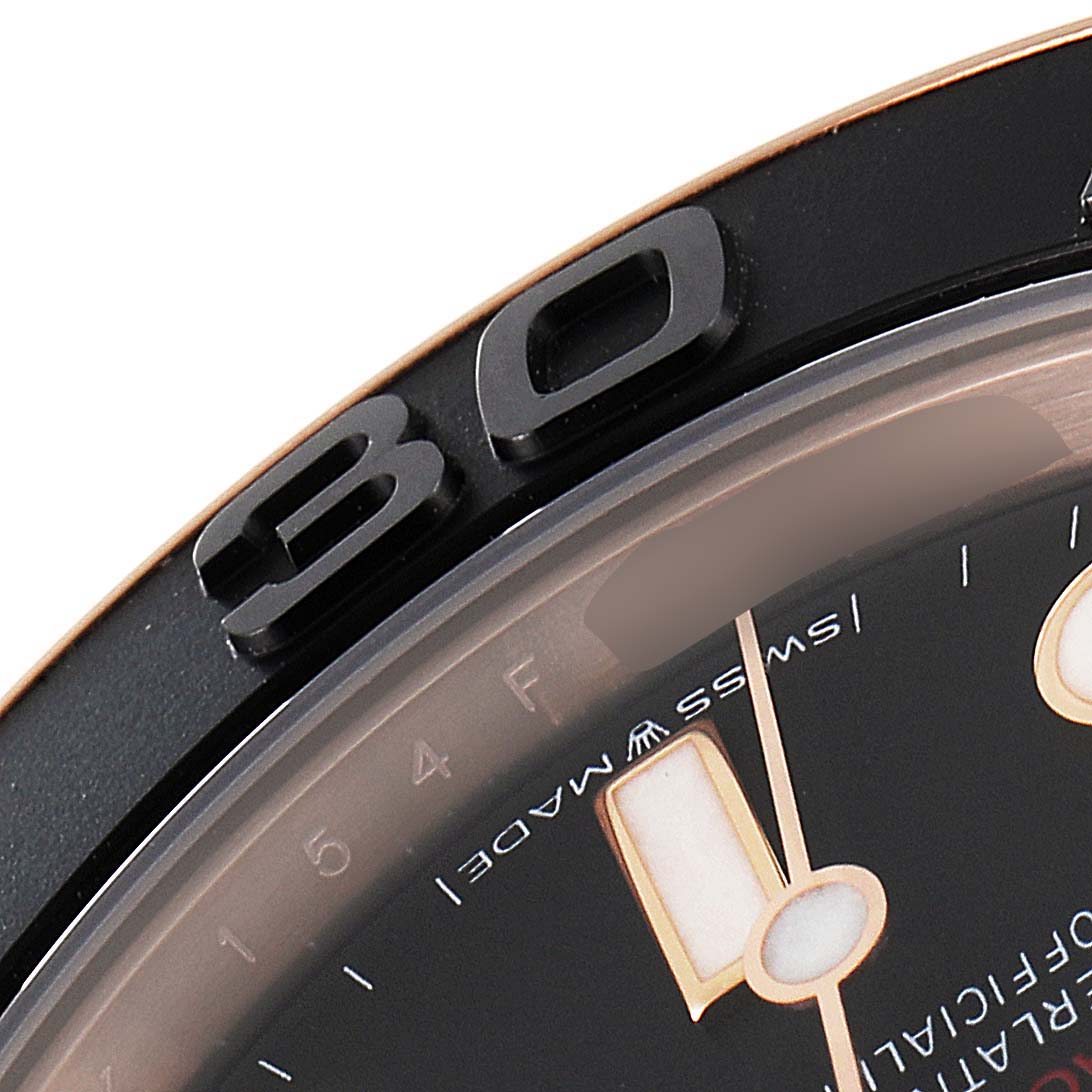 This close-up image shows the bezel and part of the dial of a Rolex Yacht-Master 268655 Men's Rose Gold Black Dial 268655 Men's Rose Gold Black Dial watch.