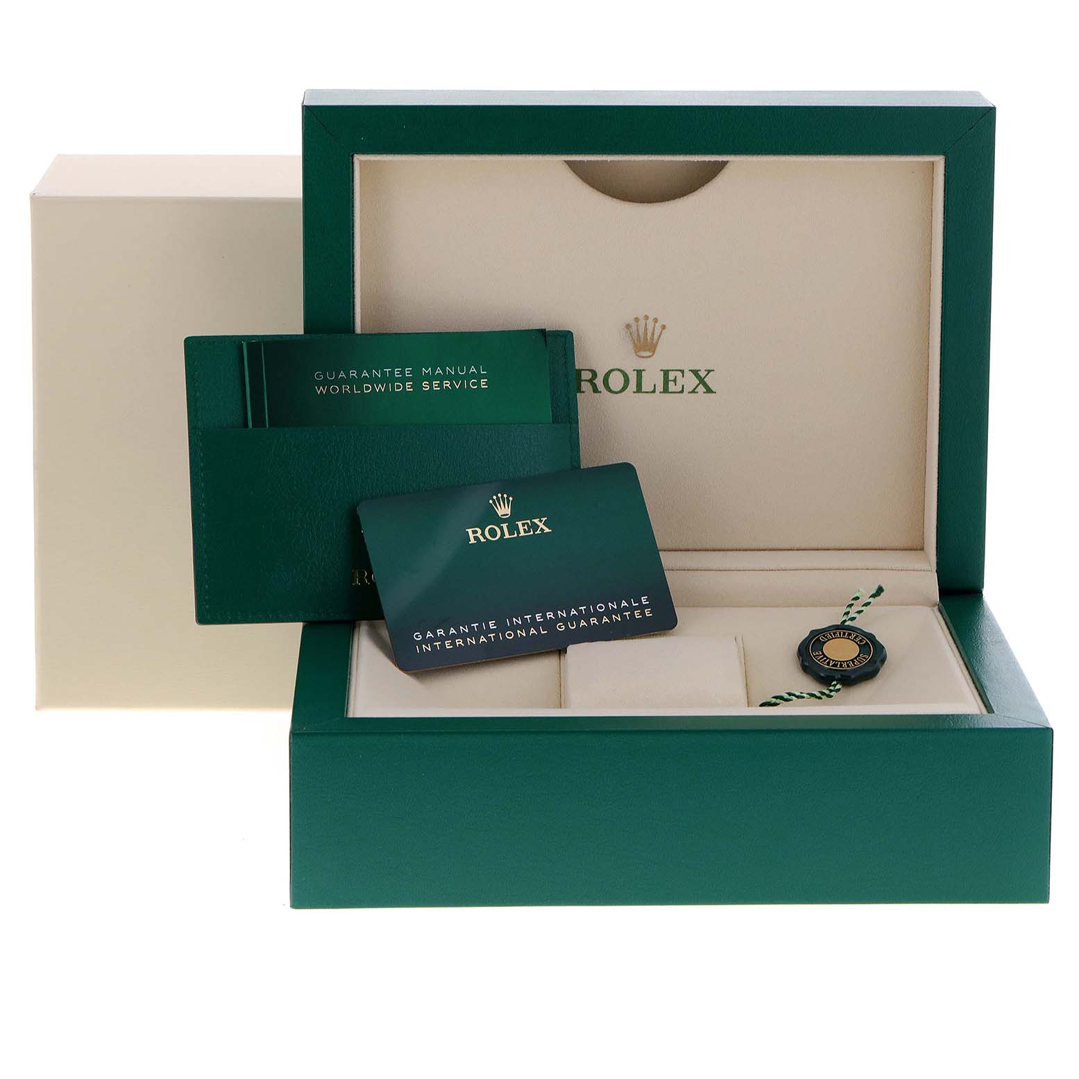 The image shows the accessories box of a Rolex Yacht-Master 268655 Men's Rose Gold Black Dial 268655 Men's Rose Gold Black Dial watch, including the guarantee manual, international warranty card, and a tag.
