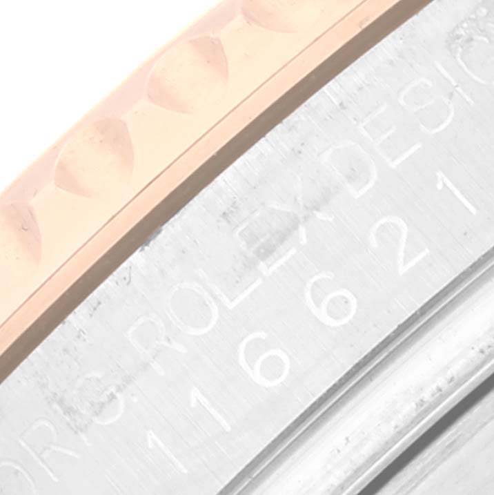 The image shows a close-up angle of the bezel and engraved text on the side of the Rolex Yacht-Master 116621 Men's Steel and Gold (two tone) Brown Dial 116621 Men's Steel and Gold (two tone) Brown Dial watch.