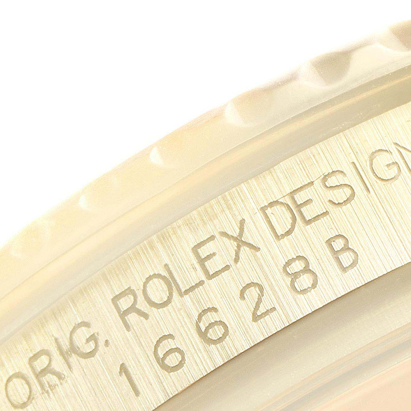 This close-up image of the Rolex Yacht-Master 16628 Men's Yellow Gold Blue Dial 16628 Men's Yellow Gold Blue Dial watch shows the engraved model number on the case side.