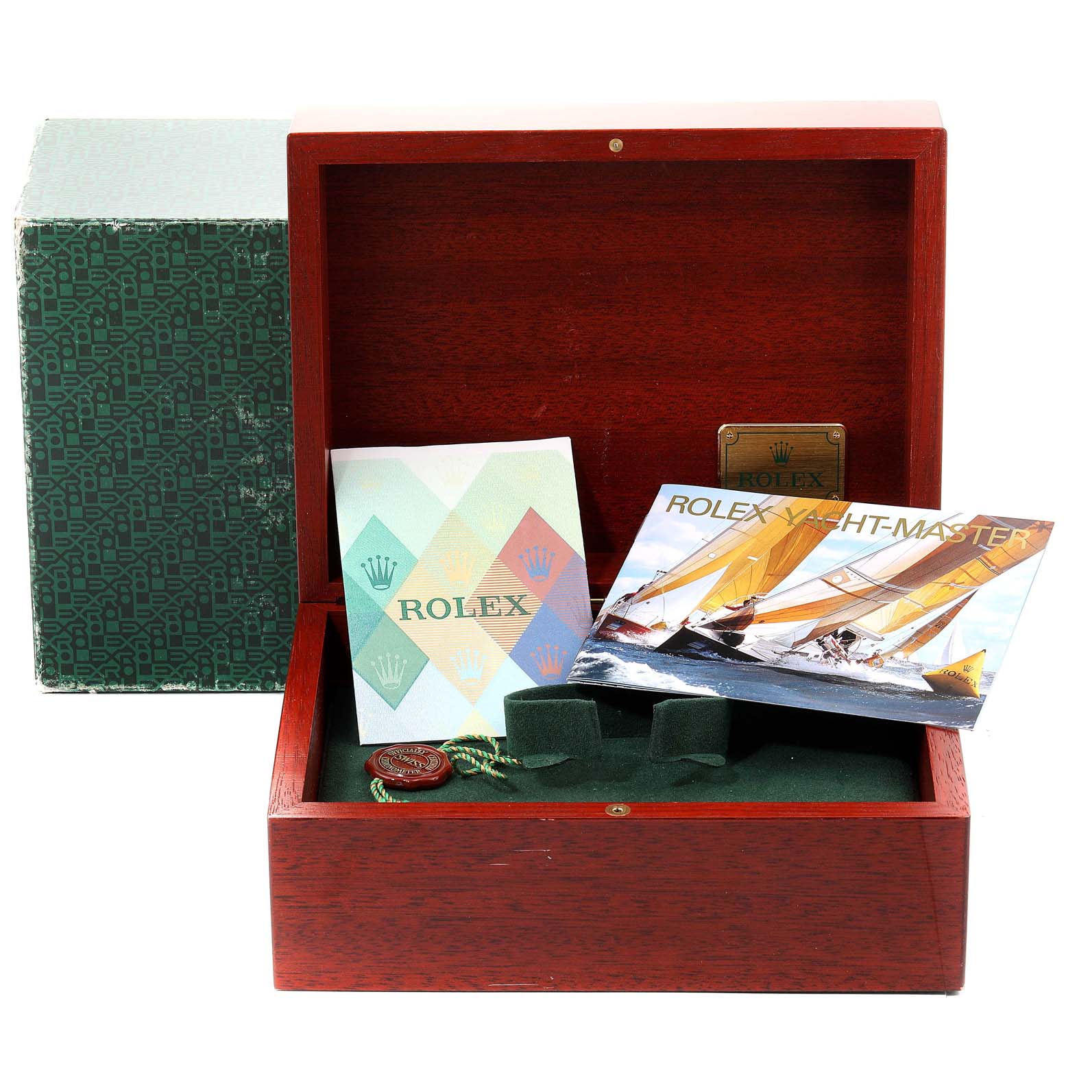The image shows a wooden Rolex box containing documentation and accessories for the Yacht-Master model, set at a front angle.