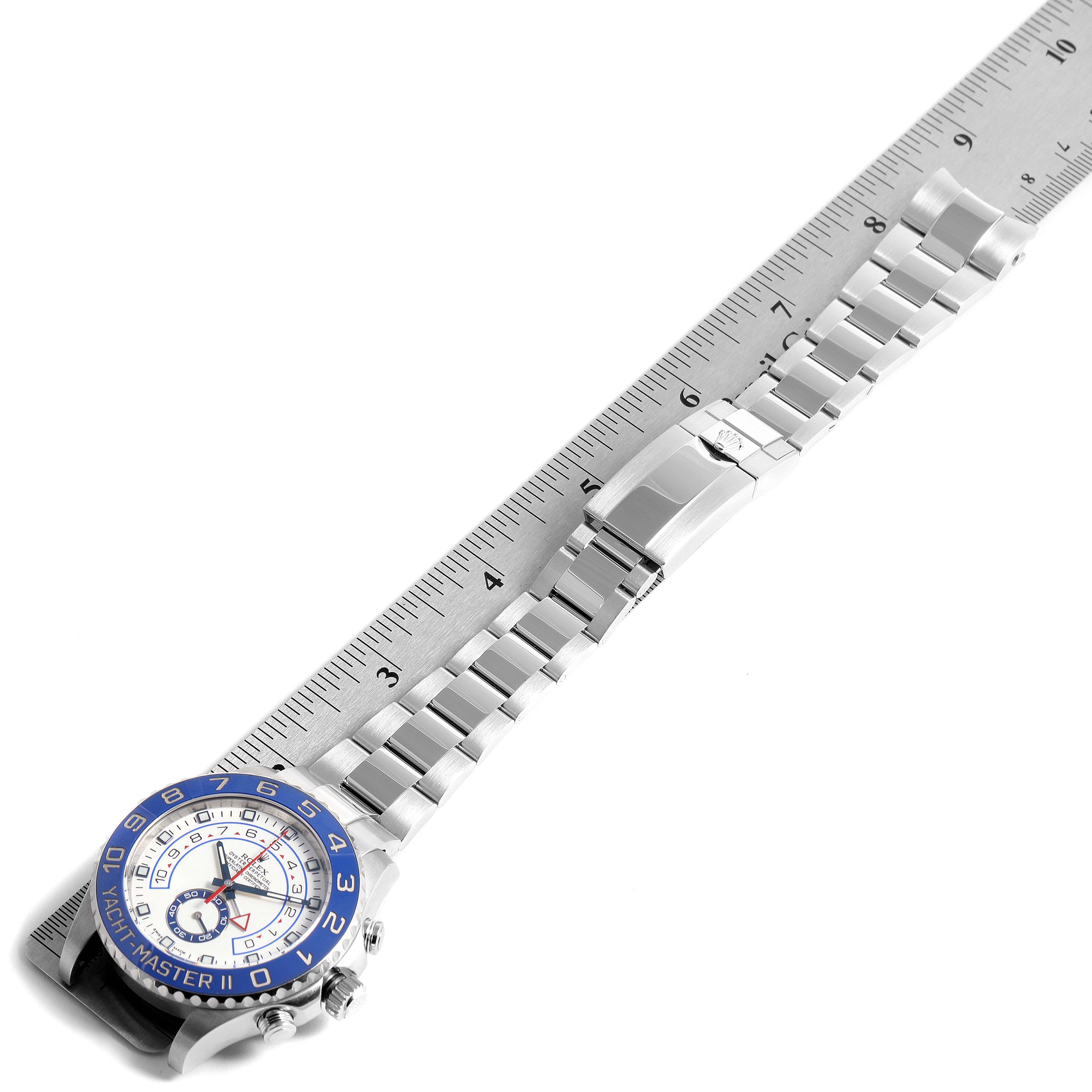 The Rolex Yacht-Master 116680 Men's Stainless Steel White Dial 116680 Men's Stainless Steel White Dial watch is shown laid flat with its bracelet extended along a ruler.