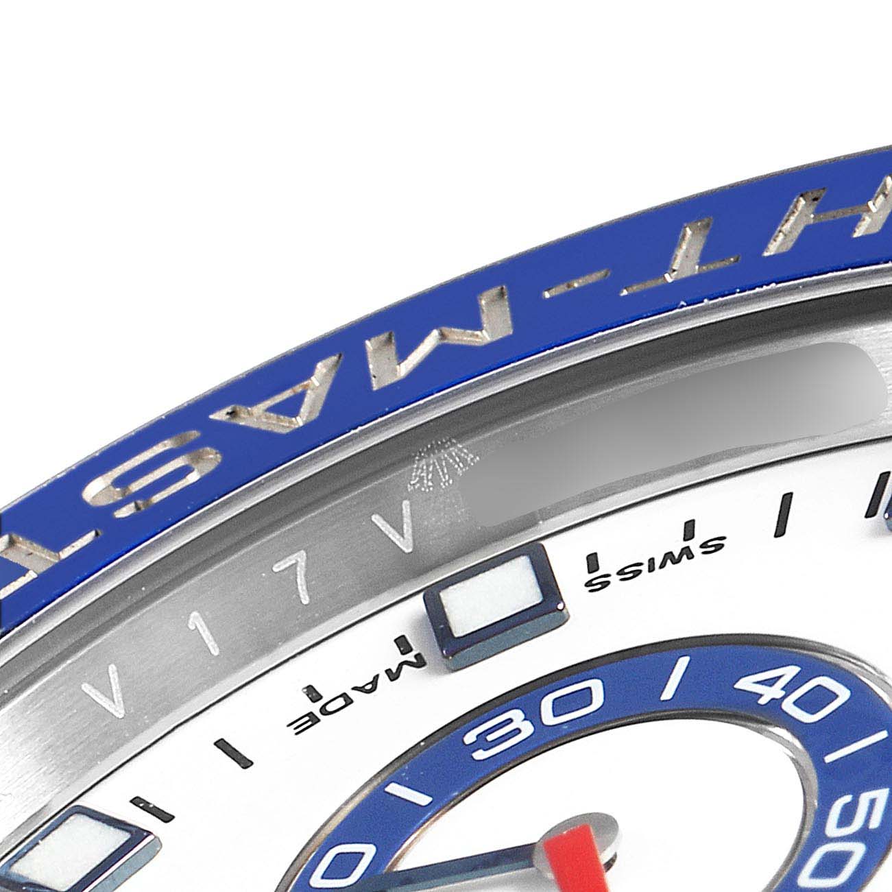 This close-up of the Rolex Yacht-Master 116680 Men's Stainless Steel White Dial 116680 Men's Stainless Steel White Dial watch showcases the upper part of the bezel and part of the dial.