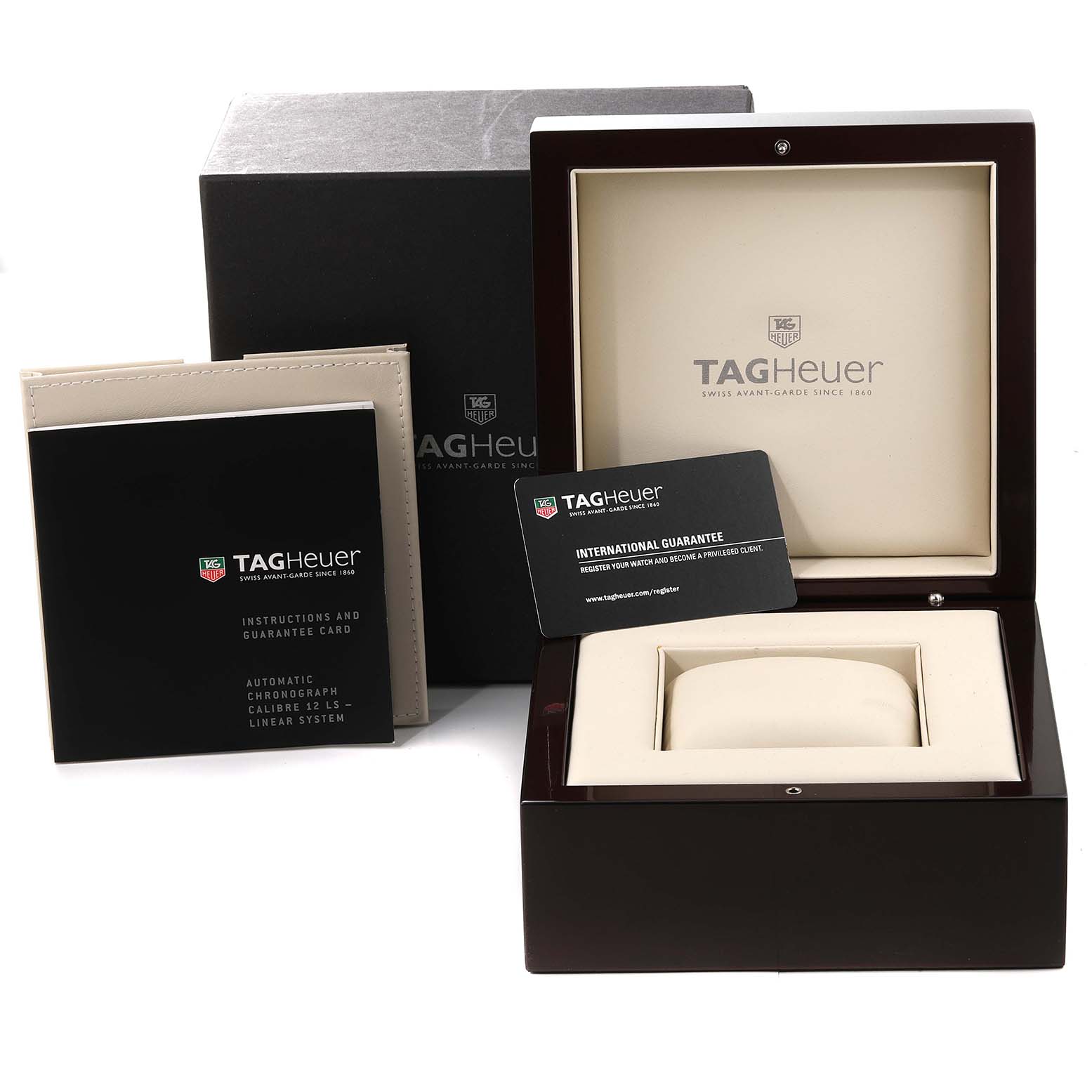 The image shows the Tag Heuer Monaco CAL2110.BA0781 Men's Stainless Steel Black Dial CAL2110.BA0781 Men's Stainless Steel Black Dial watch box, international guarantee card, instructions, and guarantee booklet.