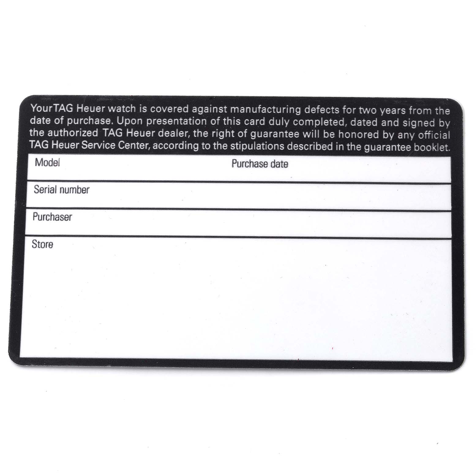 The image shows a warranty card for the Monaco model by TAG Heuer, viewed from a top-down angle.