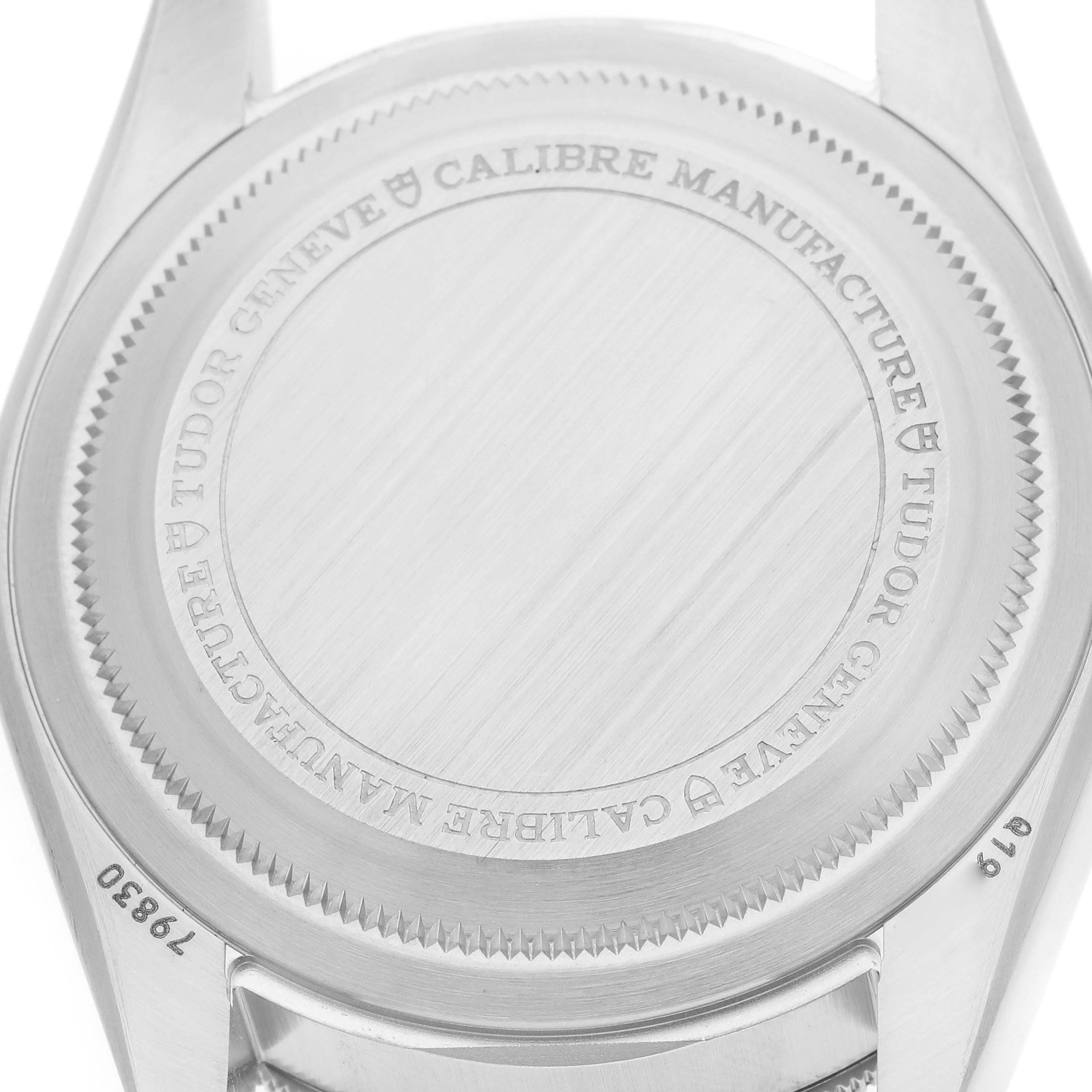 The image shows the back case of the Tudor Heritage Black Bay 79830RB Men
s Stainless Steel Black Dial watch, displaying the engraved details.