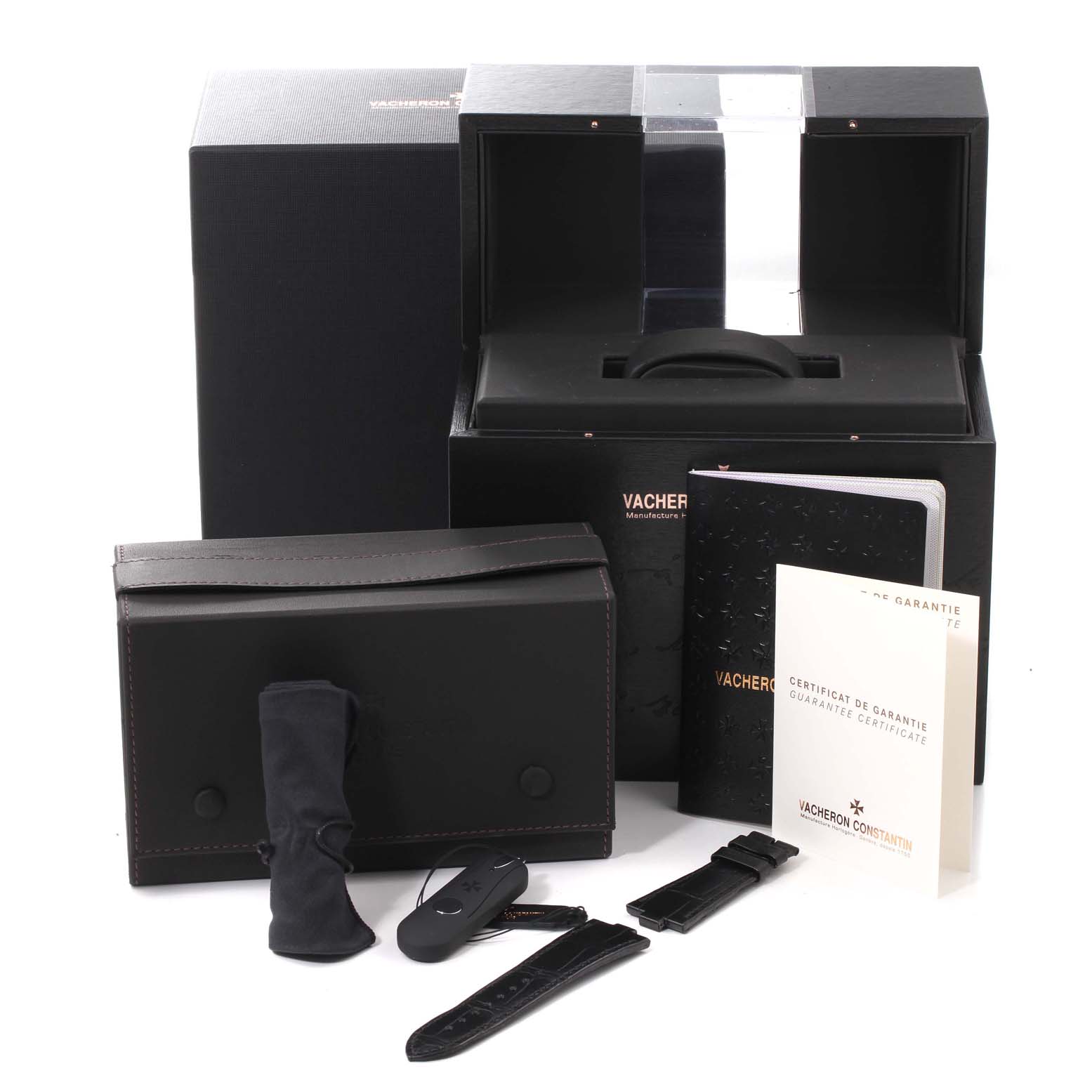 This image shows the packaging and accessories for the Vacheron Constantin Overseas 49150/000A-9017 Men
s Stainless Steel Silver Dial 49150/000A-9017 Men
s Stainless Steel Silver Dial model, including extra straps, a carrying case, and documentation.