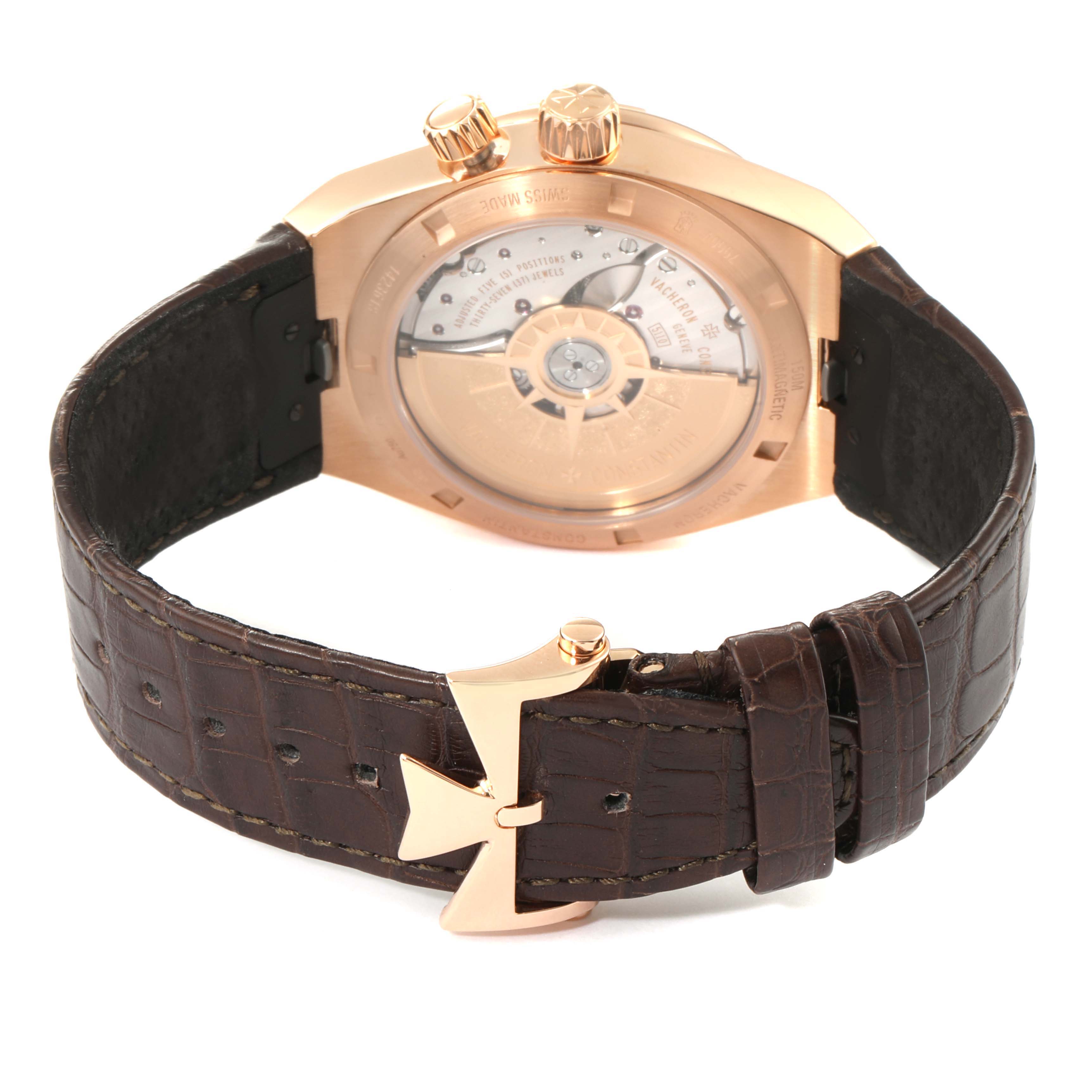 This image shows the back view of a Vacheron Constantin Overseas 7900V/000R-B336 Men
s Rose Gold Silver Dial 7900V/000R-B336 Men
s Rose Gold Silver Dial watch, highlighting its open case back and leather strap with a distinctive clasp.