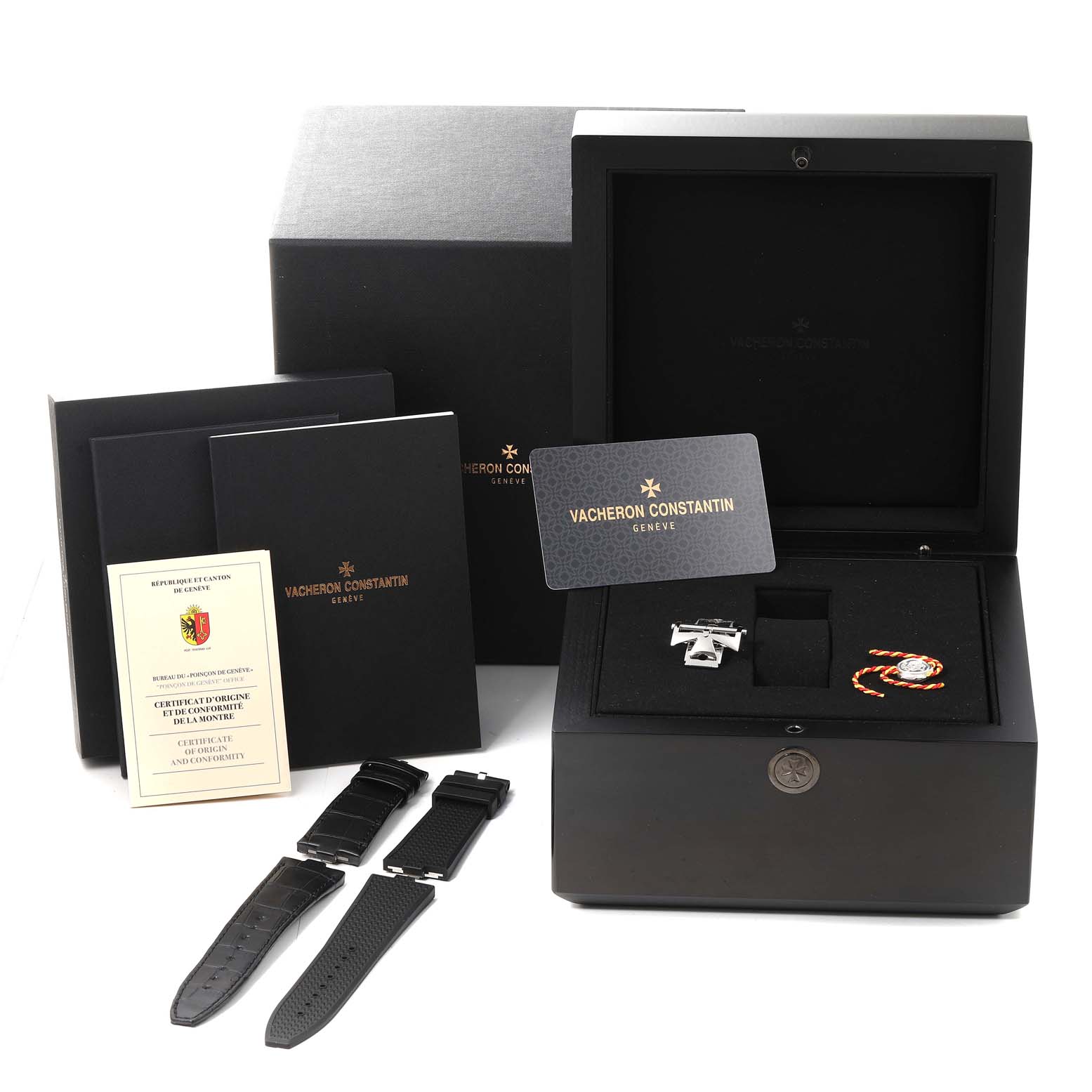 The image shows the Vacheron Constantin Overseas 7900V/110A Men's Stainless Steel Black Dial 7900V/110A Men's Stainless Steel Black Dial watch set with extra straps, certification, and packaging viewed from a front angle.