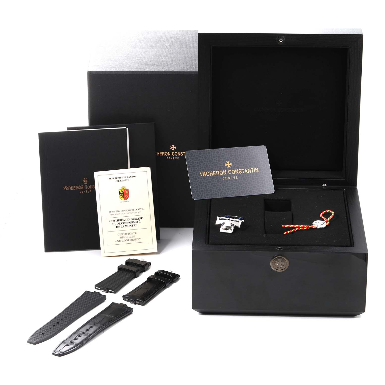 The image shows packaging, documentation, and extra straps of a Vacheron Constantin Overseas 4500V/110A-B126 Men's Stainless Steel Silver Dial 4500V/110A-B126 Men's Stainless Steel Silver Dial watch from a frontal angle.