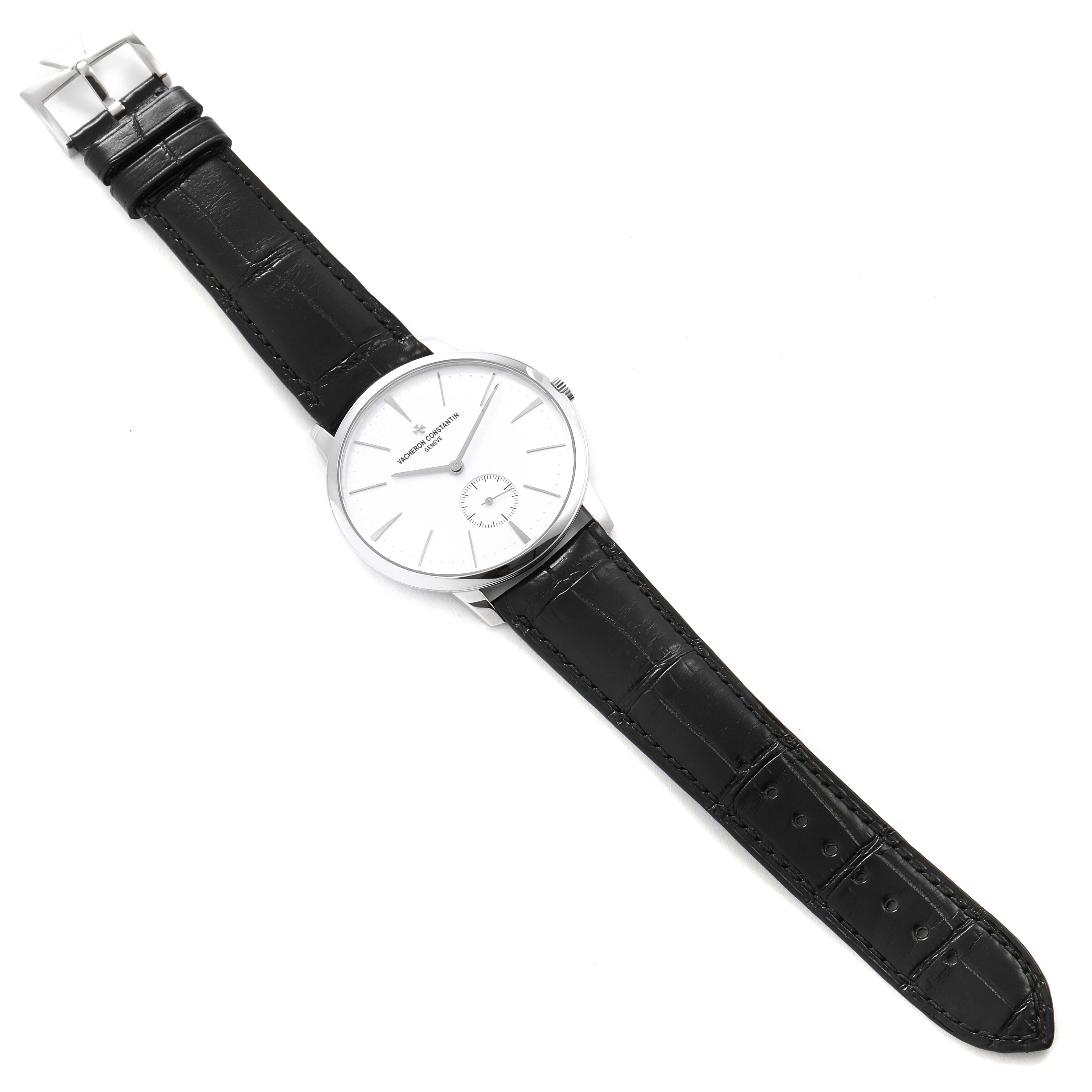 The image shows a Vacheron Constantin Patrimony 1110U/000G-B086 Men's White Gold Silver Dial 1110U/000G-B086 Men's White Gold Silver Dial watch from a top-down angle, displaying the dial, case, crown, and black leather strap.