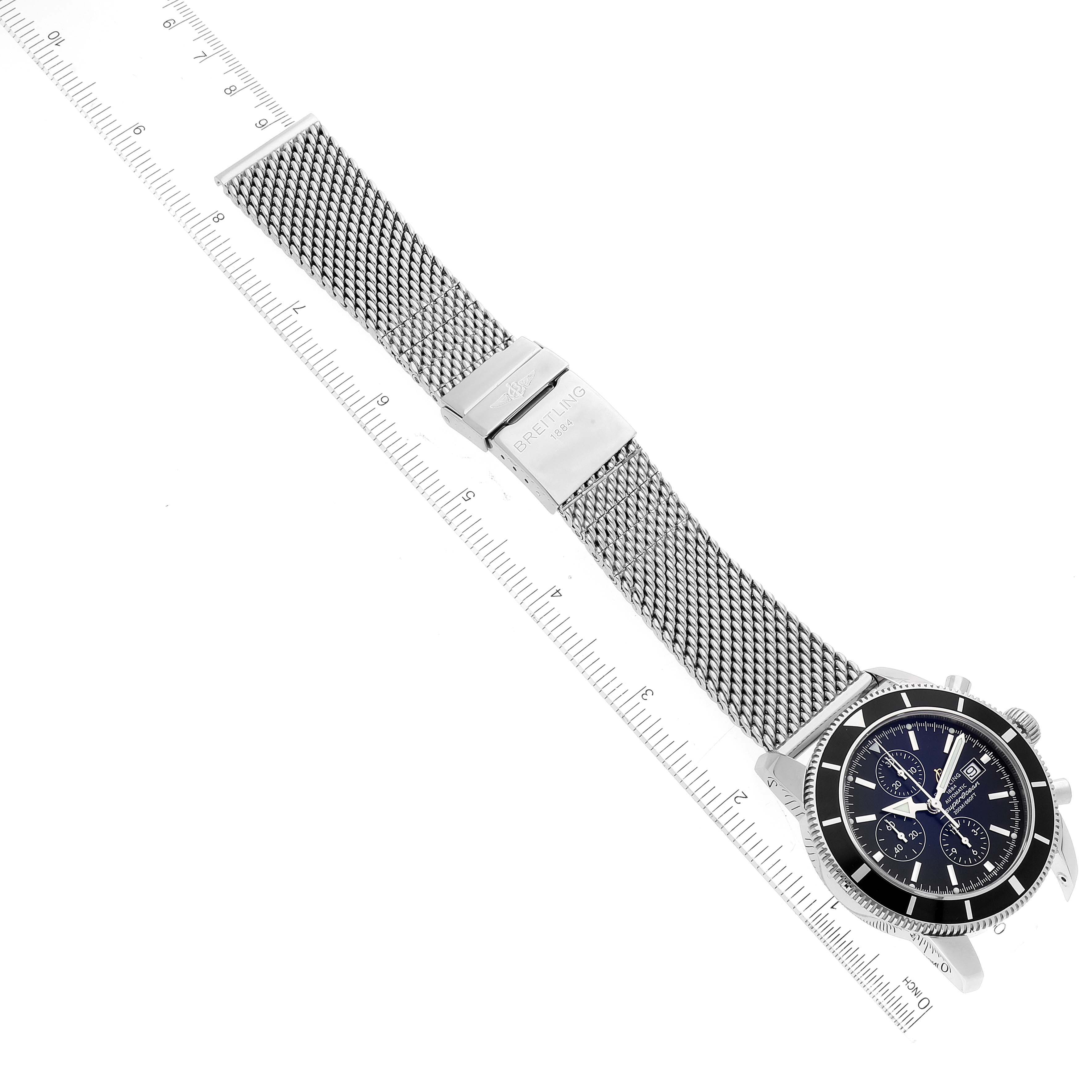 The image shows a top-down view of a Breitling Superocean A13320 Men's Stainless Steel Black Dial A13320 Men's Stainless Steel Black Dial watch, with a focus on its dial and mesh band.