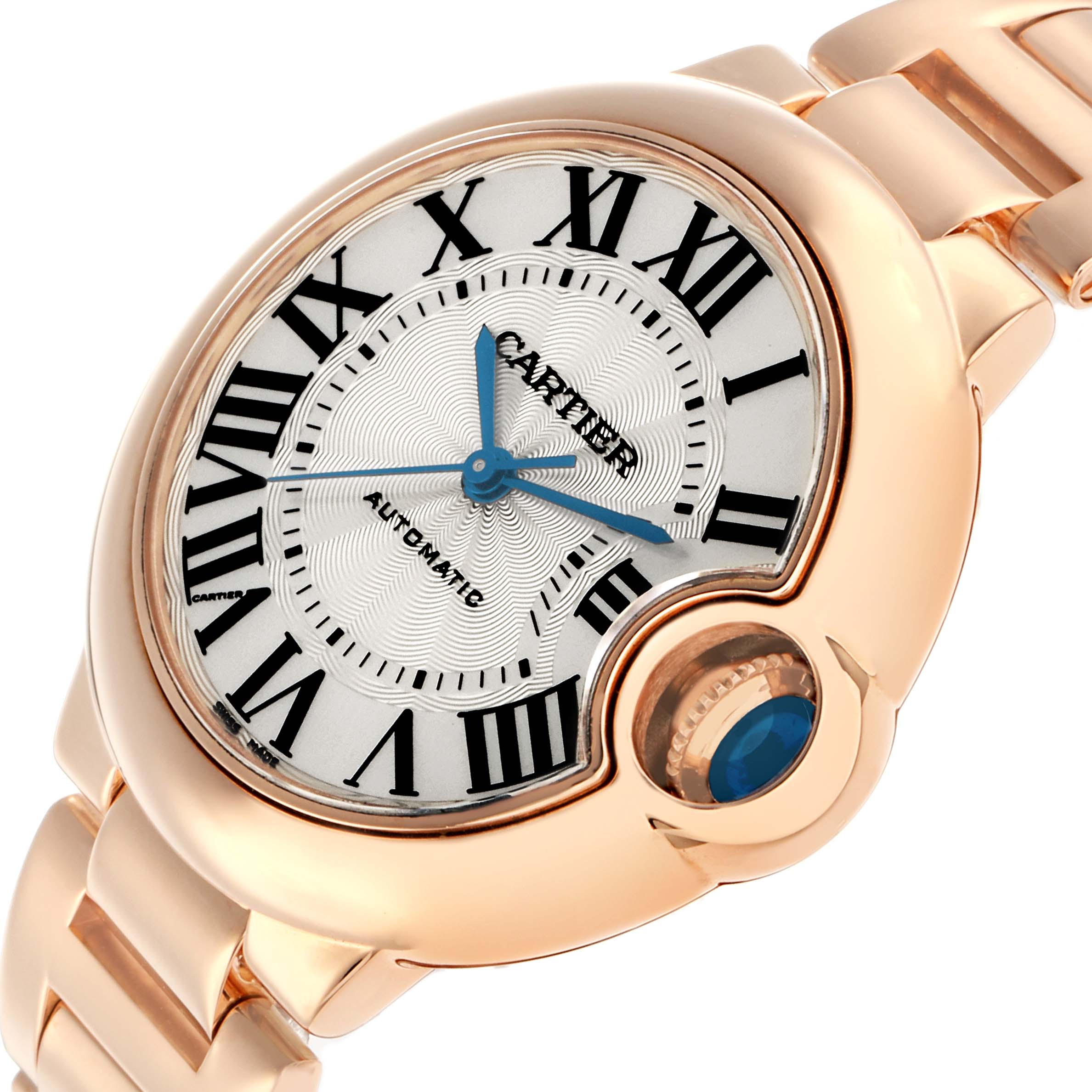 The Ballon Bleu by Cartier is shown at an angled view, highlighting the face, Roman numerals, and crown with a blue cabochon.