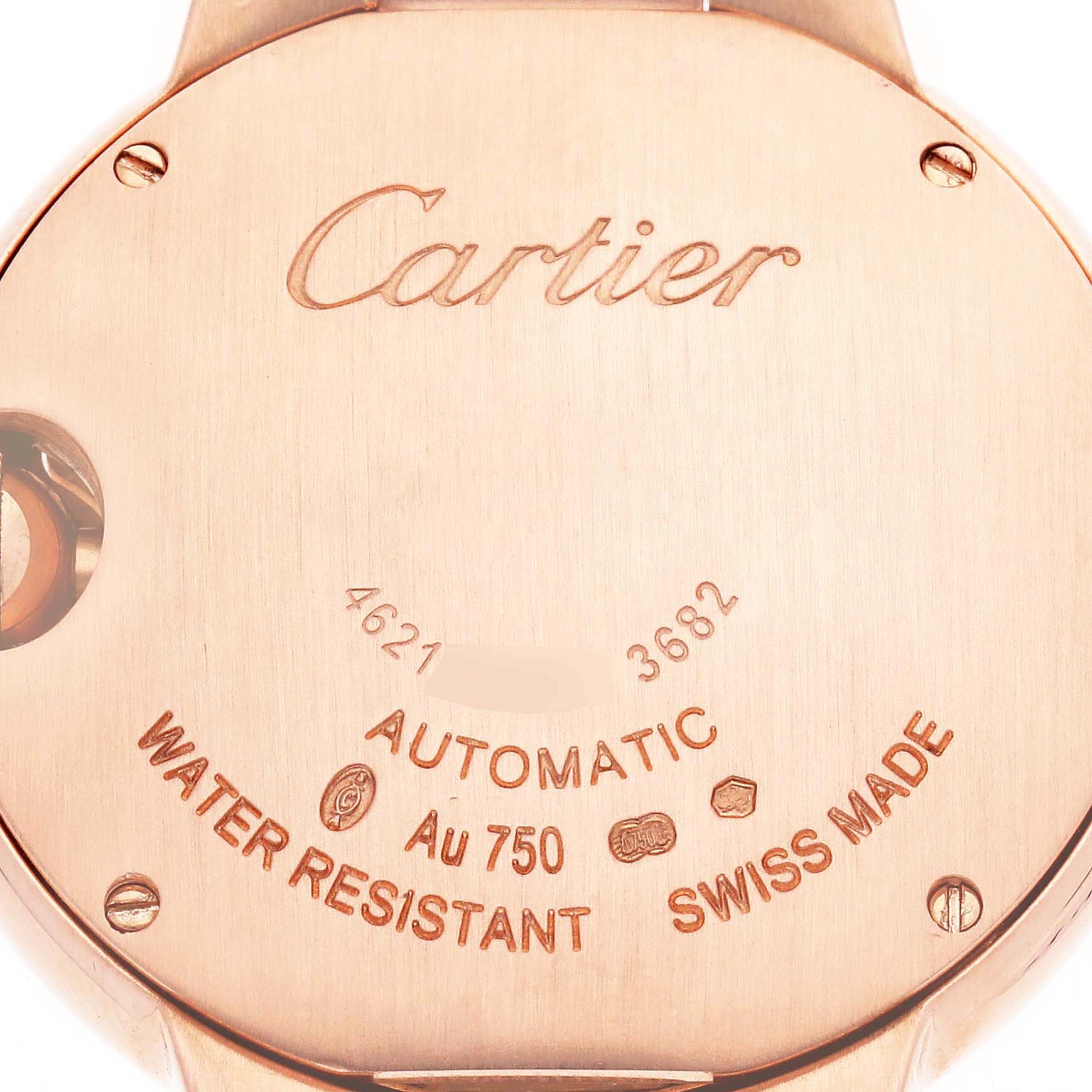 The image shows a close-up of the Cartier Ballon Bleu W6920096 Women
s Rose Gold Silver Dial watch
s case back, featuring engravings about its specifications.