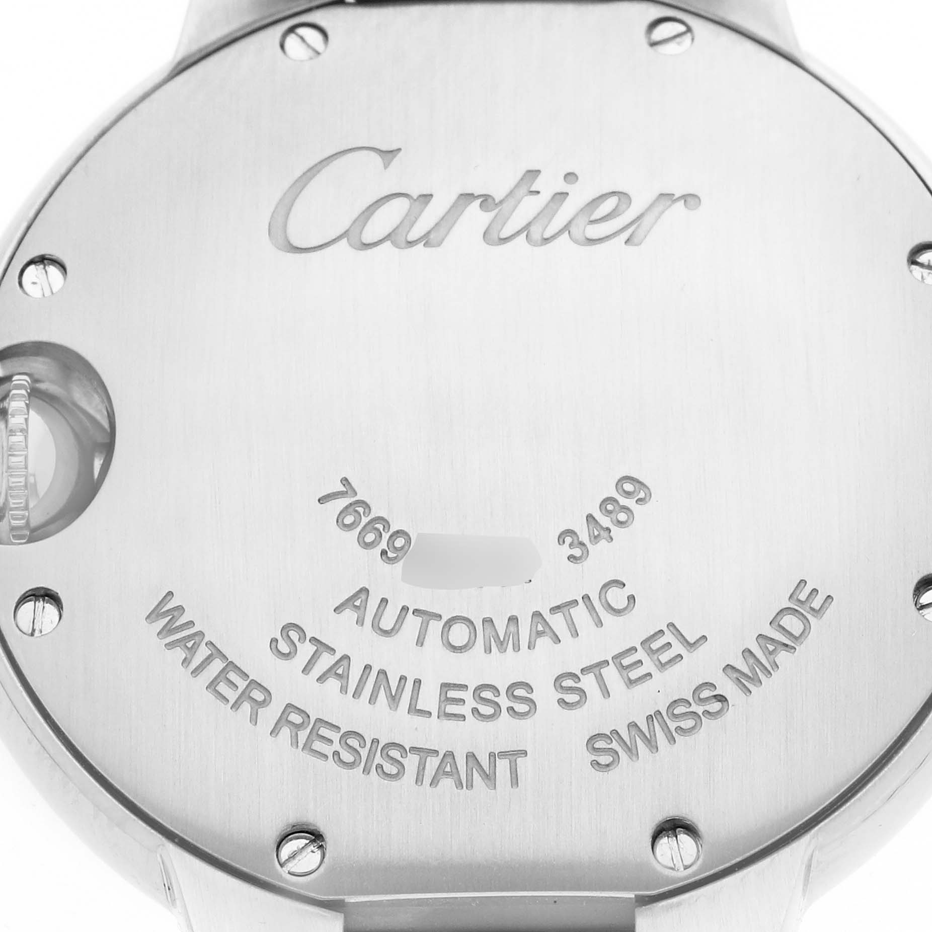 The image shows the case back of a Cartier Ballon Bleu WSBB0002 Women
s Stainless Steel Pink Dial watch, highlighting its inscriptions and screws.
