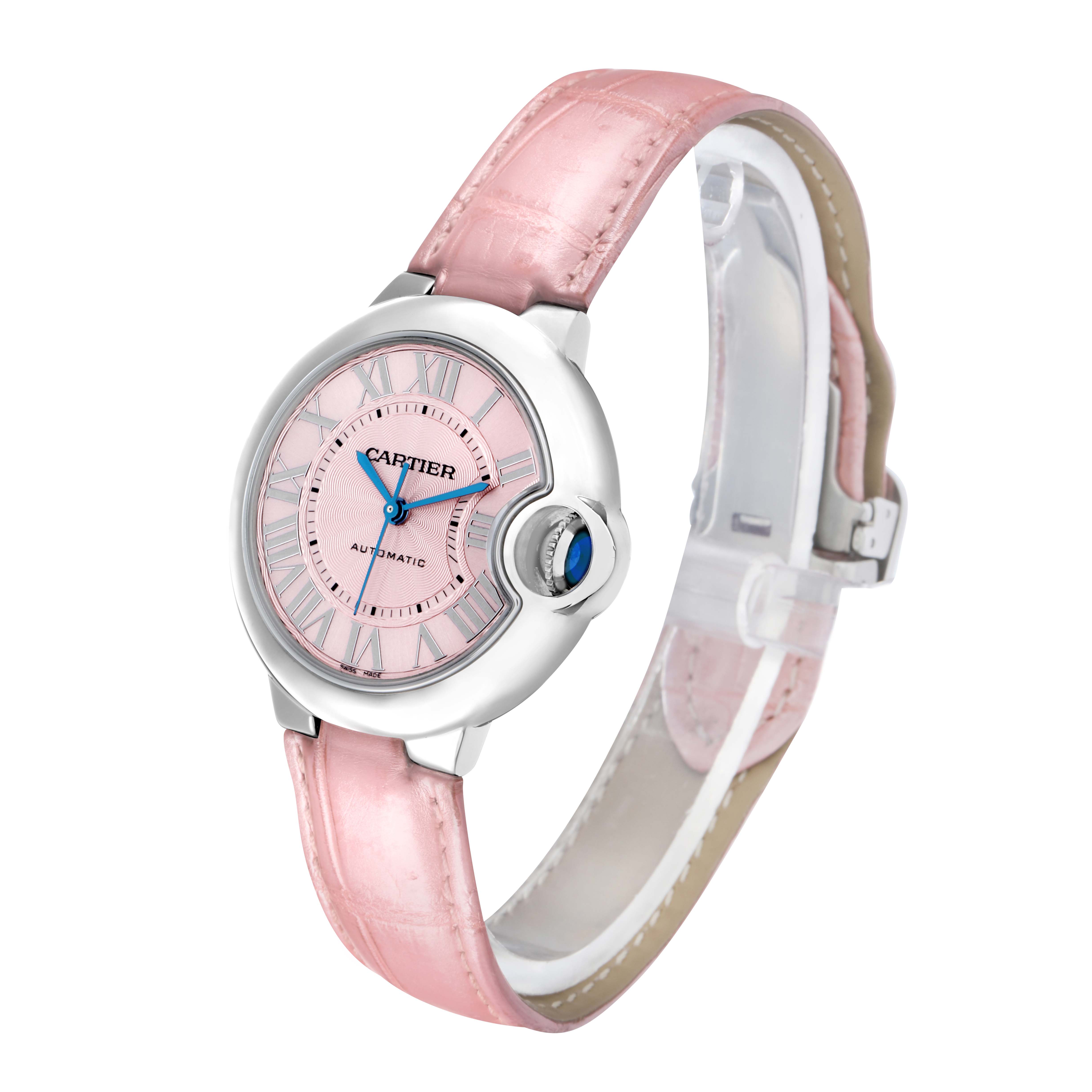 The Cartier Ballon Bleu WSBB0002 Women
s Stainless Steel Pink Dial watch is shown at an angle highlighting the face, crown, and pink strap.