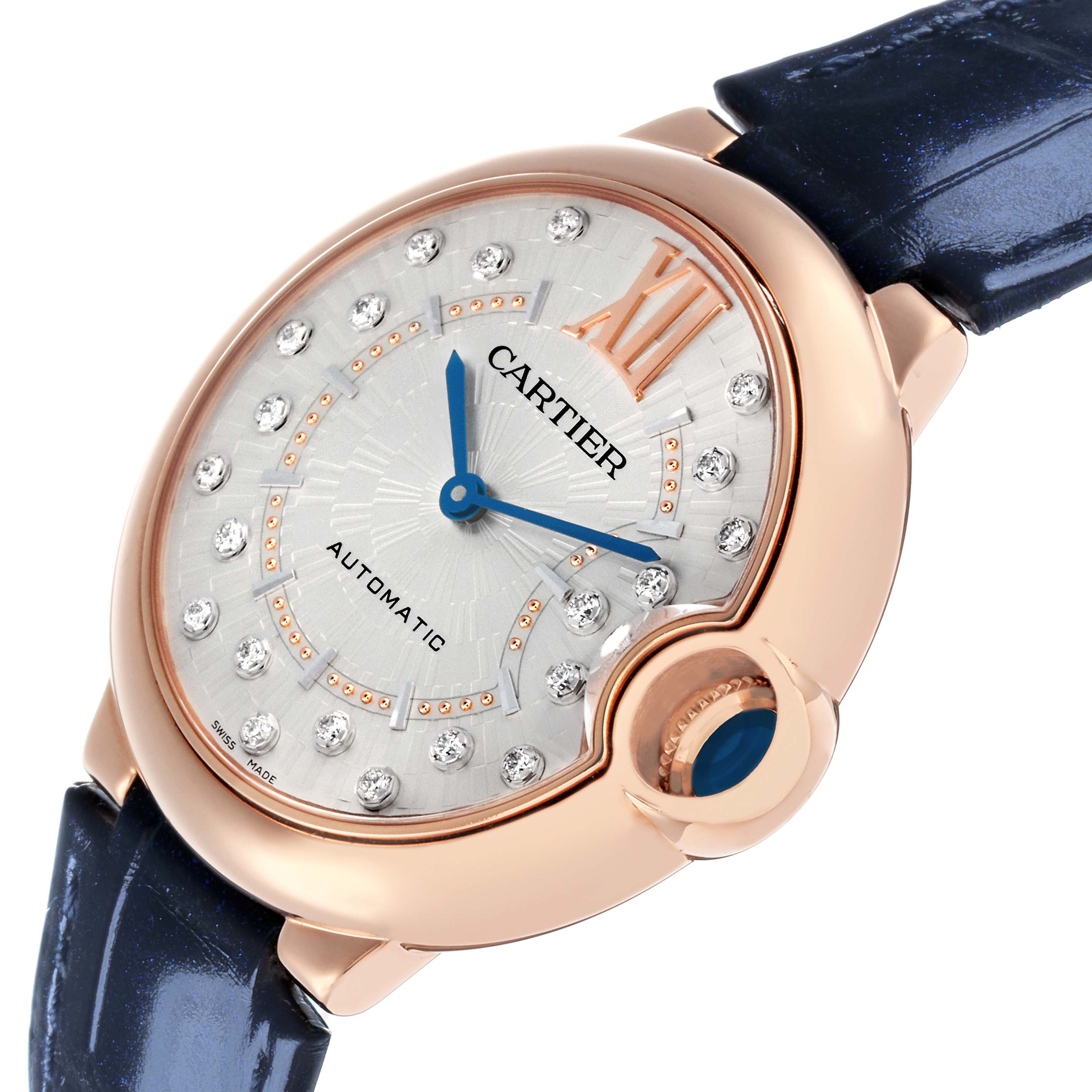 The Ballon Bleu de Cartier watch is shown from a three-quarter angle, revealing its dial, blue sword-shaped hands, and distinctive crown.