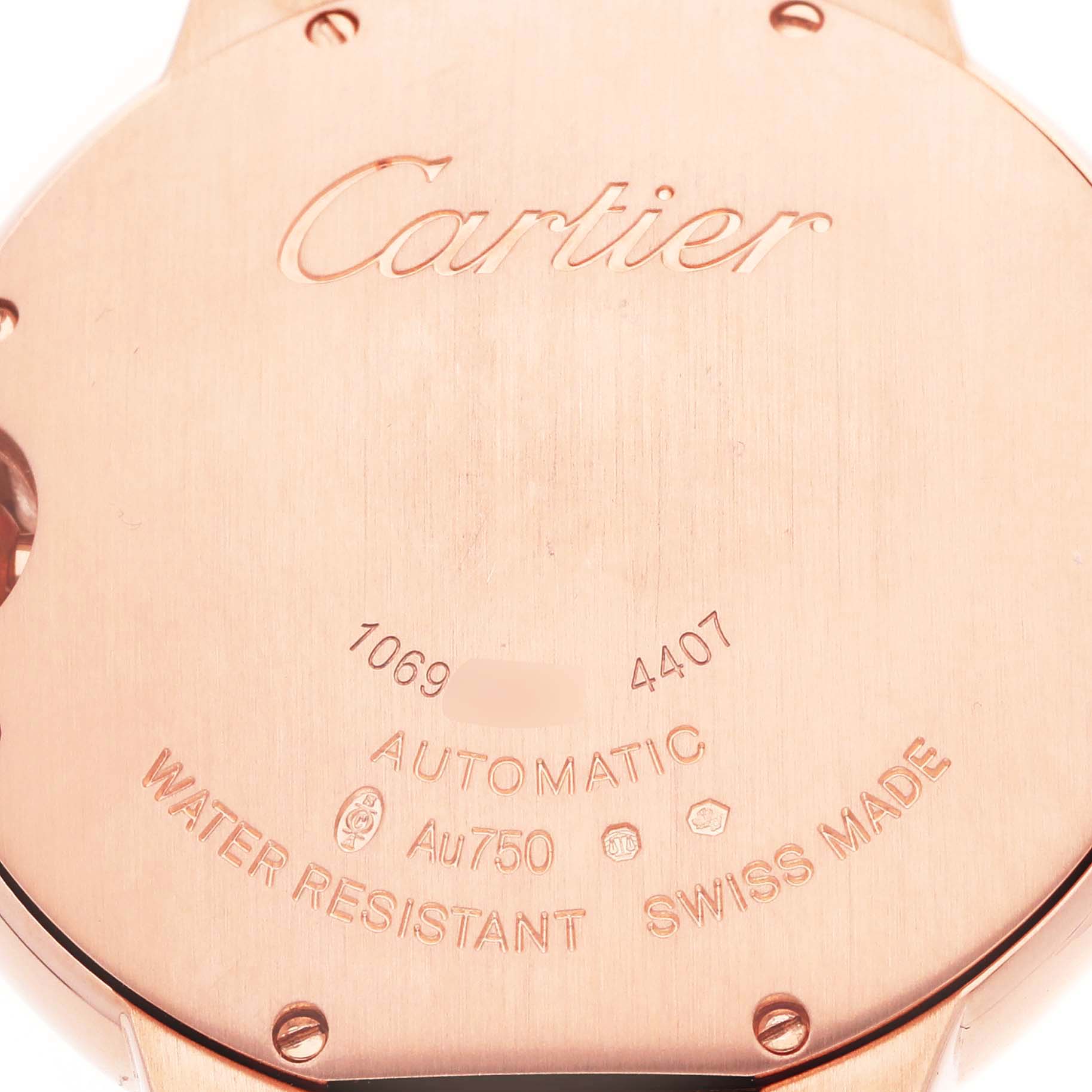 The image shows the back case of a Cartier Ballon Bleu WGBB0053 Men's Rose Gold Silver Dial watch, highlighting brand engravings and specifications.
