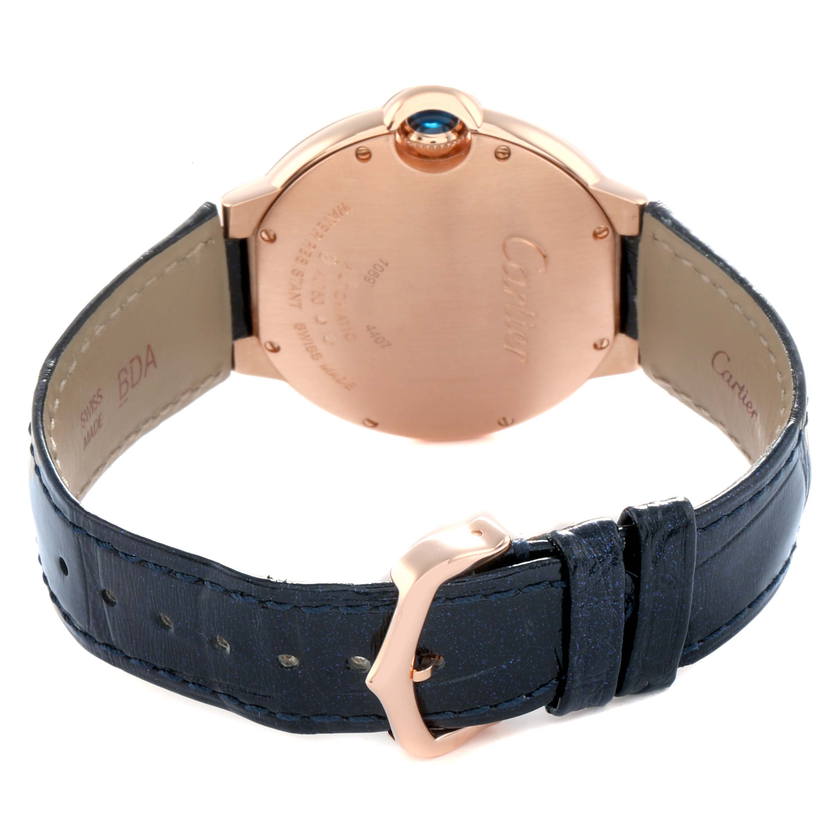The image shows the back and side view of a Cartier Ballon Bleu WGBB0053 Men's Rose Gold Silver Dial watch, highlighting the case back, blue cabochon crown, and leather strap.