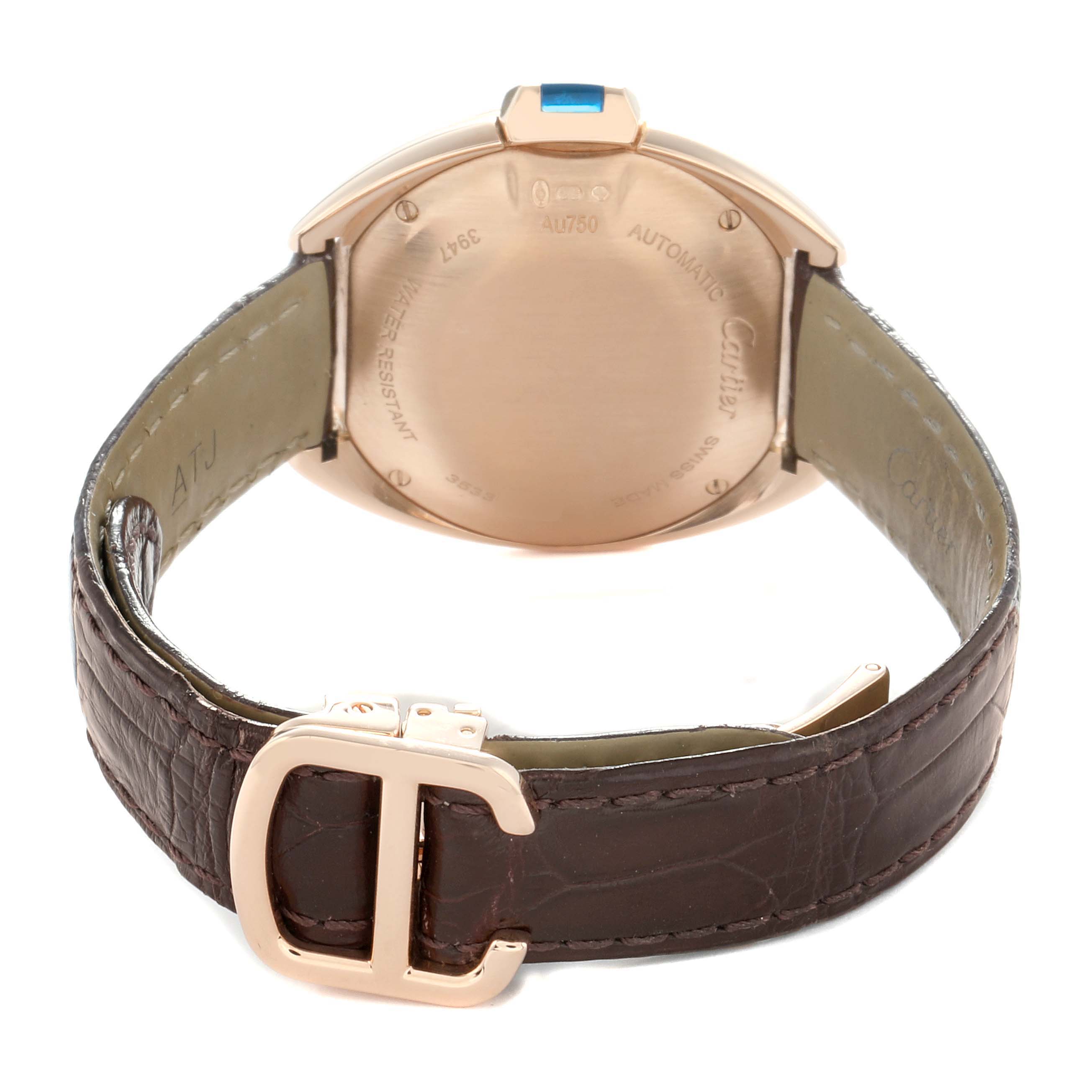 The image shows the back of a Cartier Clé watch, featuring the case back, strap, and clasp in a rear view angle.