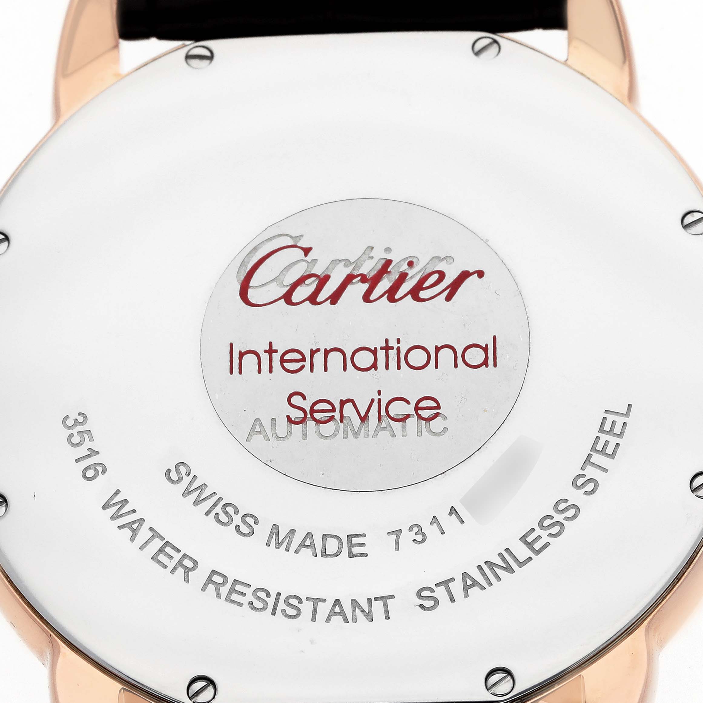 The image shows the back of the Cartier Ronde W6701009 Men
s Rose Gold Silver Dial watch, featuring details about its Swiss-made stainless steel case.