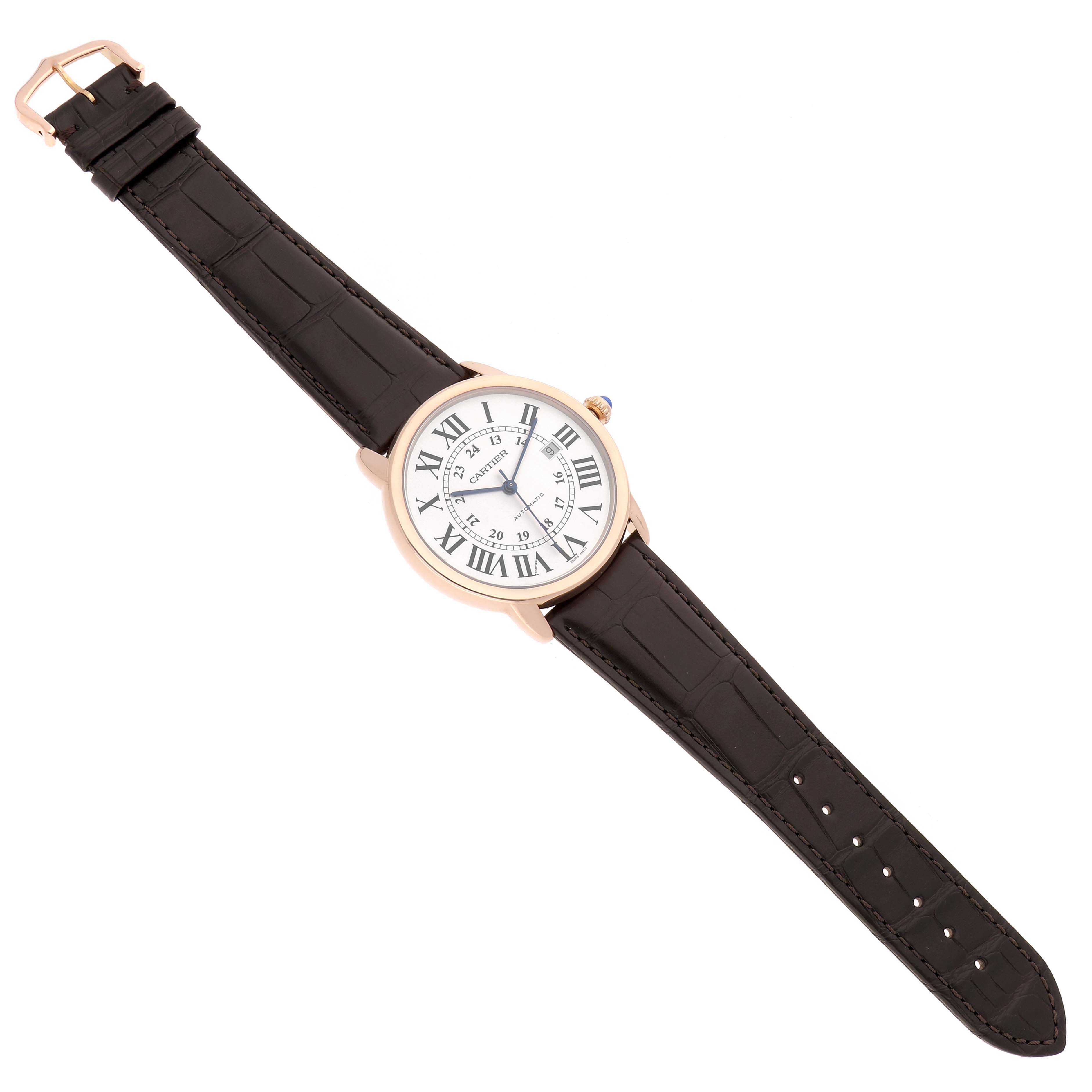 The Cartier Ronde W6701009 Men
s Rose Gold Silver Dial watch is shown at a slight diagonal angle, displaying its face, brown strap, and gold buckle.
