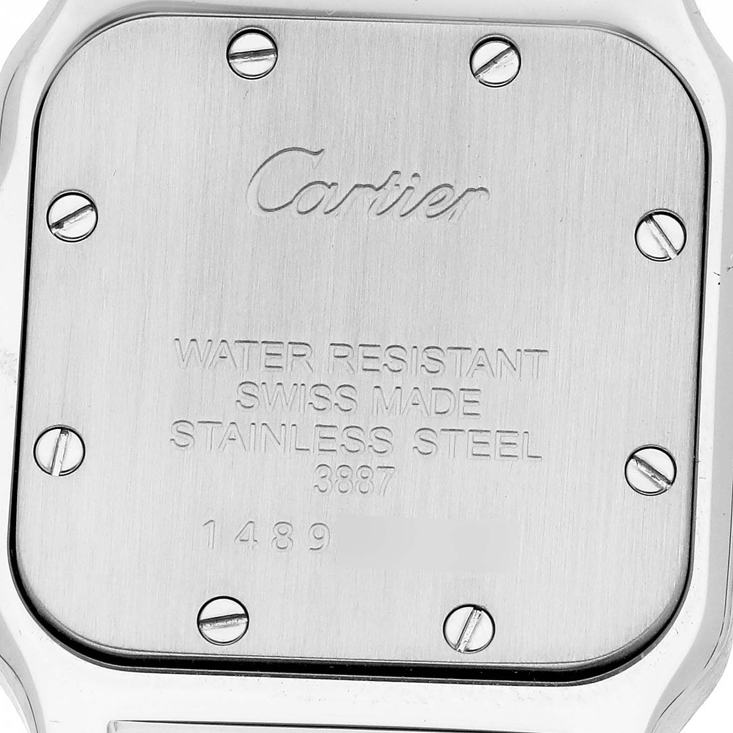 The image shows the back case of a Cartier Santos W20012C4 Women's Steel and Gold (two tone) Silver Dial W20012C4 Women's Steel and Gold (two tone) Silver Dial watch, displaying screws and engravings with specifications.