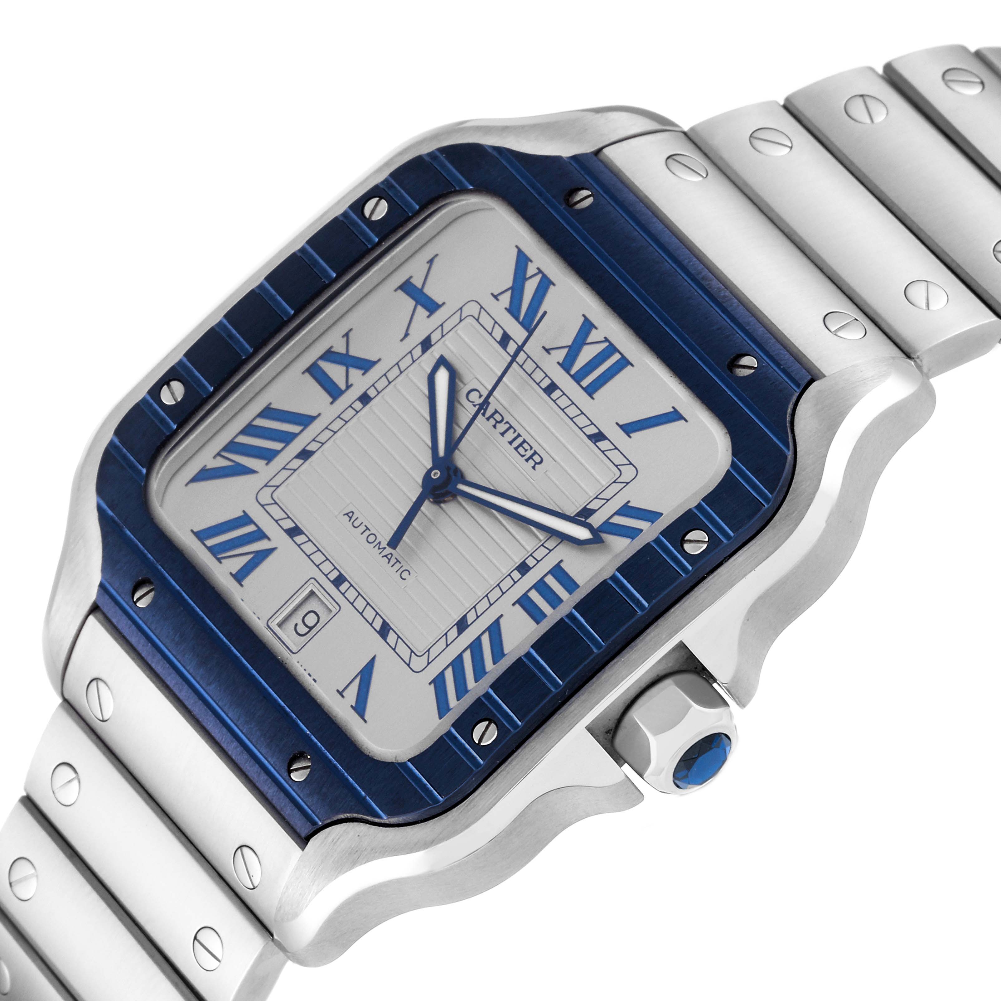 This image shows a close-up angled view of the Cartier Santos WSSA0047 Men
s Stainless Steel Silver Dial WSSA0047 Men
s Stainless Steel Silver Dial watch, highlighting the face, bezel, crown, and part of the bracelet.