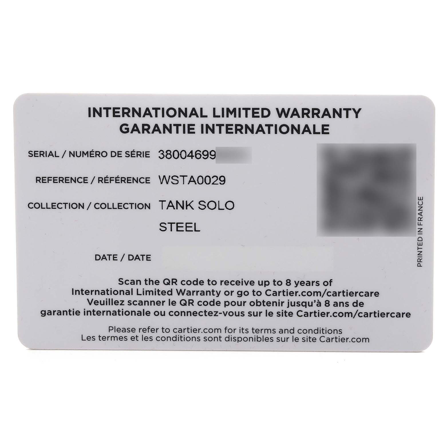 This image shows the warranty card for a Cartier Tank Solo WSTA0029 Men's Stainless Steel Silver Dial WSTA0029 Men's Stainless Steel Silver Dial watch, displaying serial and reference numbers.