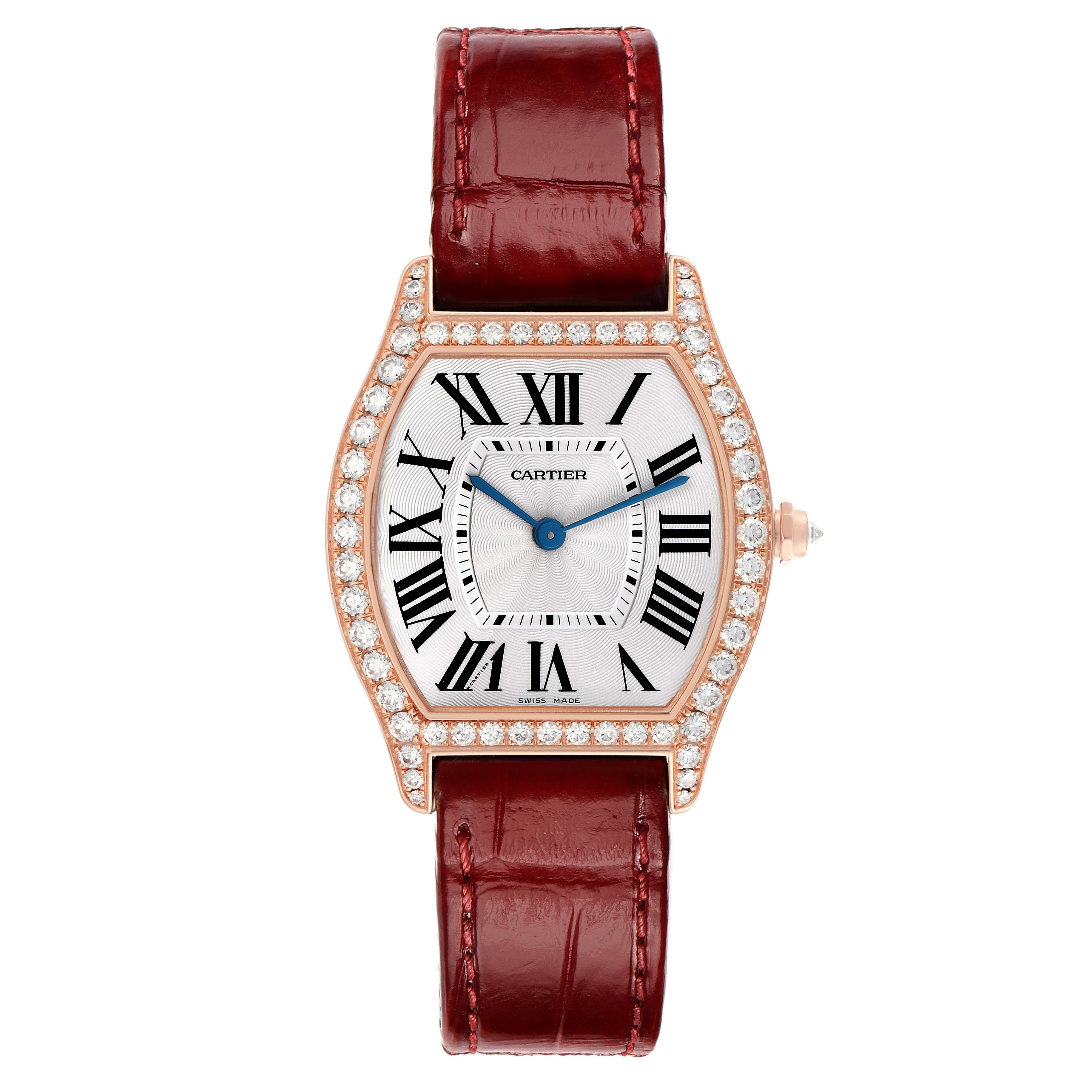 The Cartier Tortue WA501008 Women's Rose Gold Silver Dial watch is shown from the front, featuring its diamond-set case and red strap.