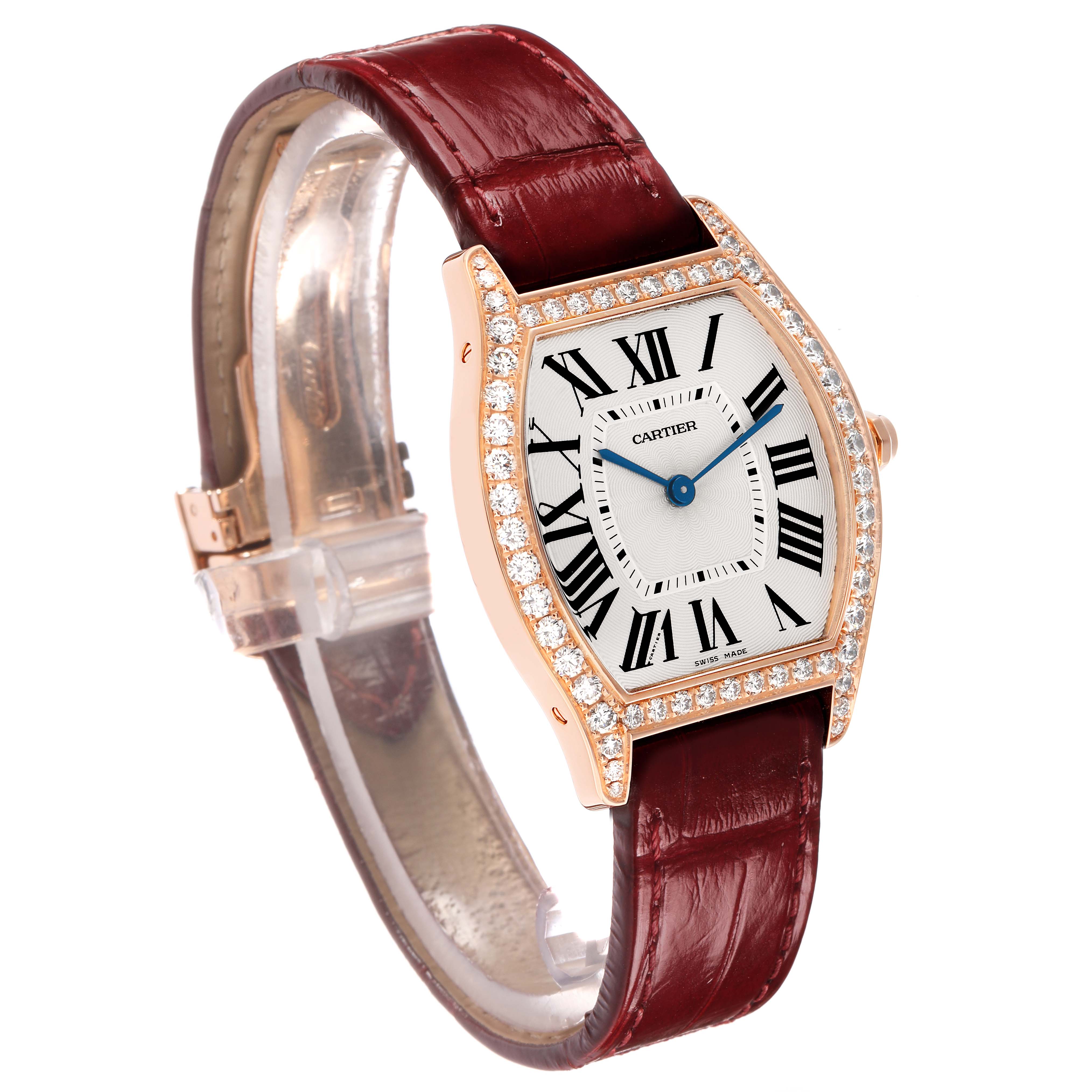 The Cartier Tortue WA501008 Women's Rose Gold Silver Dial watch is shown at a three-quarter angle, highlighting the diamond bezel, Roman numeral face, and burgundy strap.