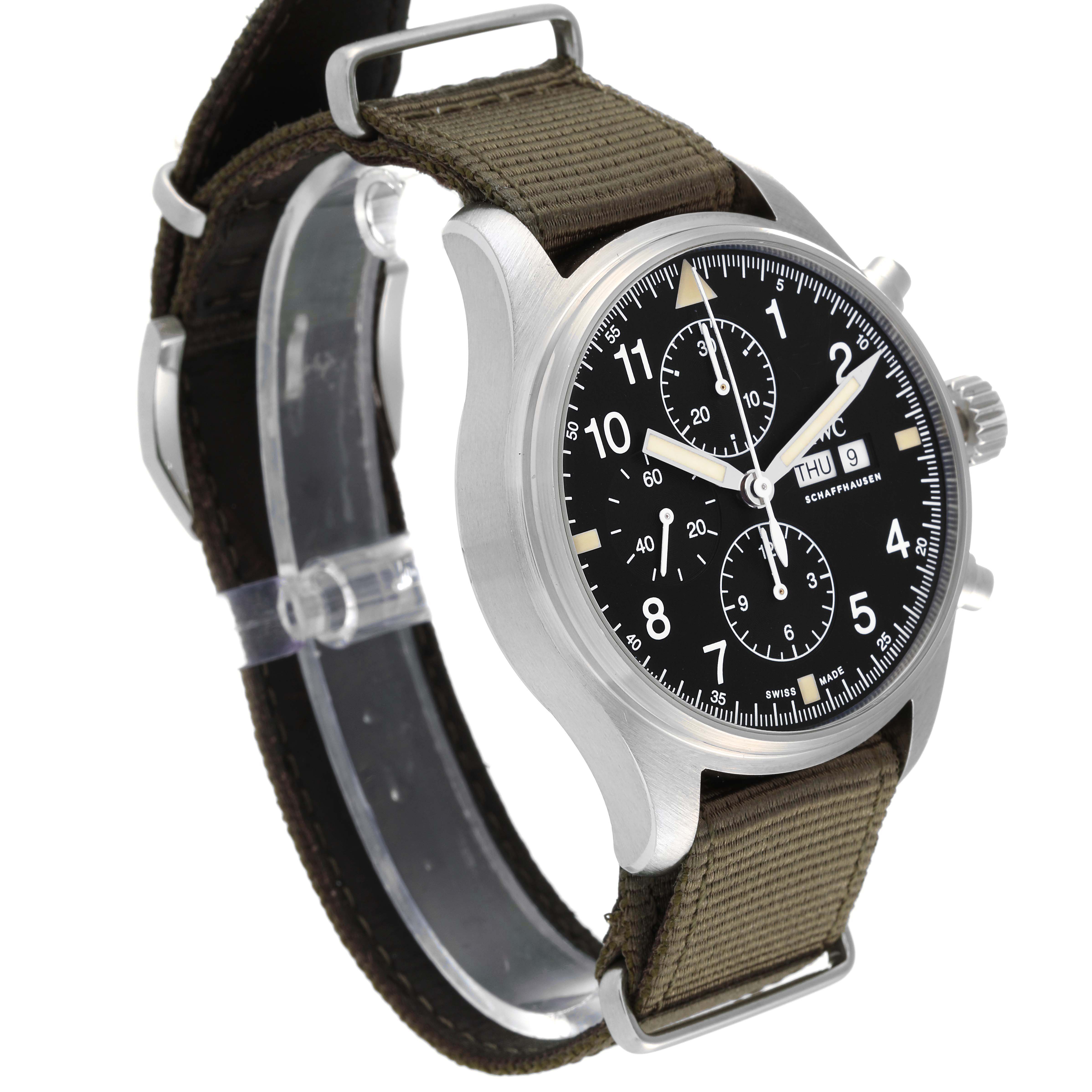 The IWC Pilot IW377724 Men's Stainless Steel Black Dial IW377724 Men's Stainless Steel Black Dial watch is shown at an angled side view, highlighting its dial, chronograph buttons, and olive green fabric strap.