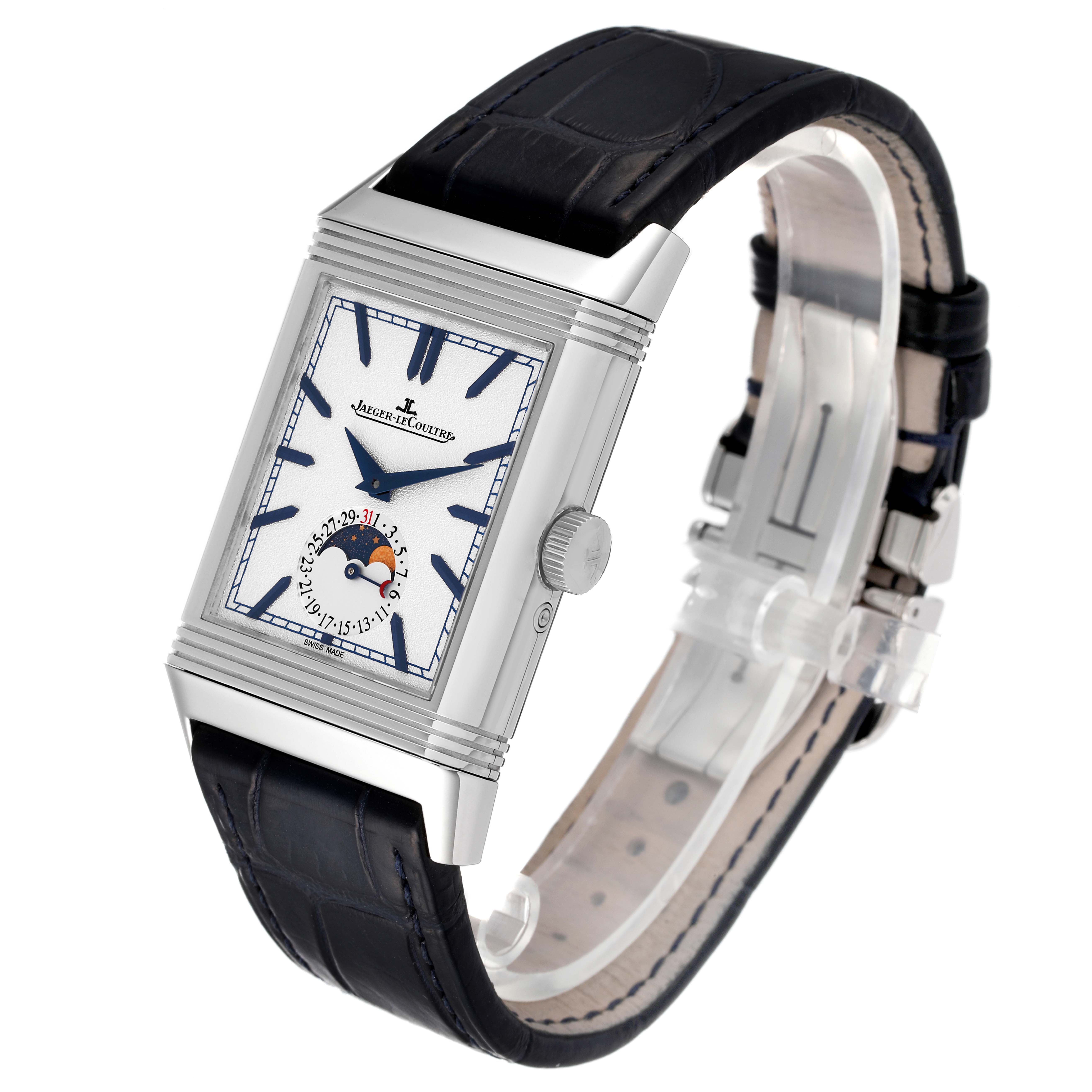 The Jaeger LeCoultre Reverso Q3958420 Men's Stainless Steel Blue Dial Q3958420 Men's Stainless Steel Blue Dial watch is shown at a three-quarter angle, highlighting the face, moon phase, strap, and side crown.