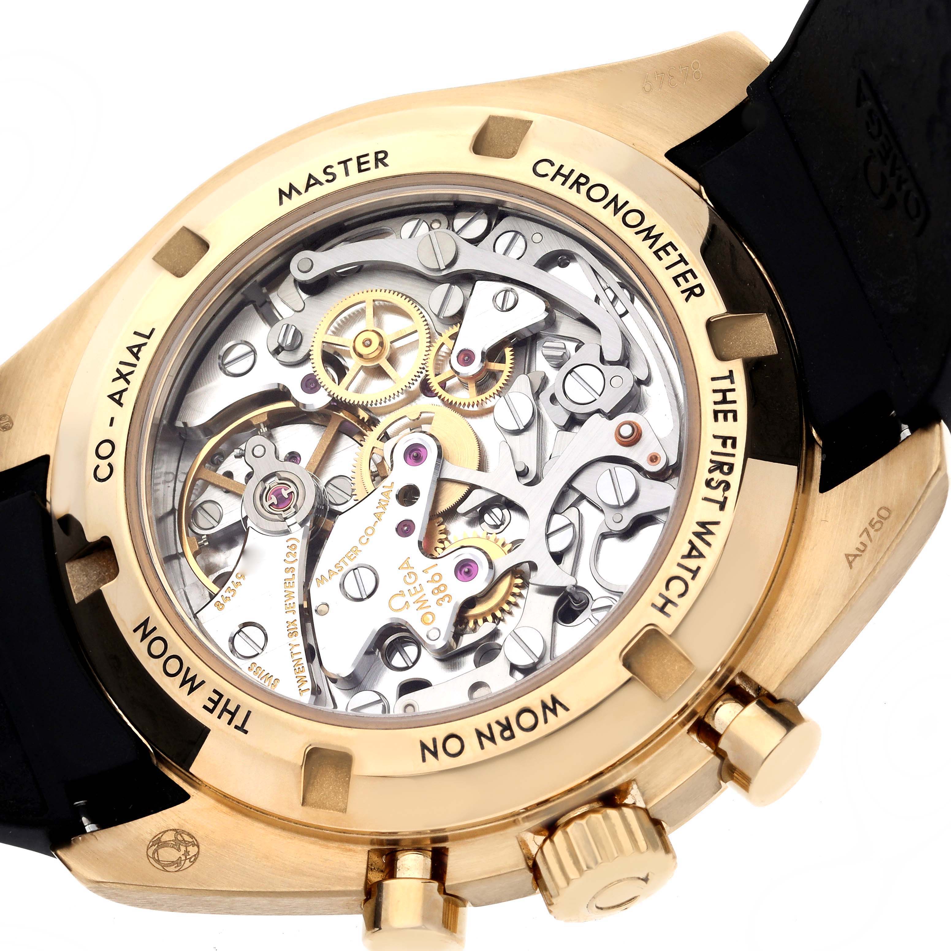 The image shows the back of the Omega Speedmaster 310.62.42.50.99.001 Men's Yellow Gold Champagne Dial 310.62.42.50.99.001 Men's Yellow Gold Champagne Dial, highlighting its intricate movement and gold casing.