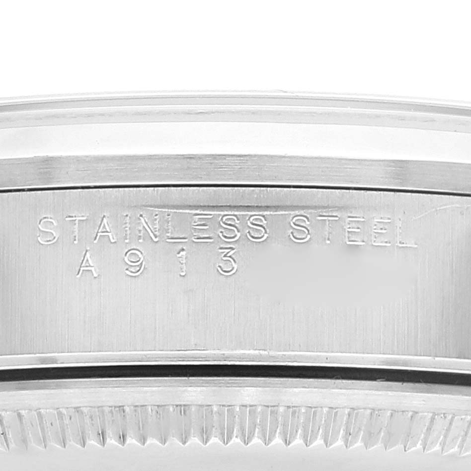 This image shows a close-up of the side of a Rolex Air-King 14000 Men's Stainless Steel Blue Dial 14000 Men's Stainless Steel Blue Dial watch case, indicating "Stainless Steel" with a reference number.
