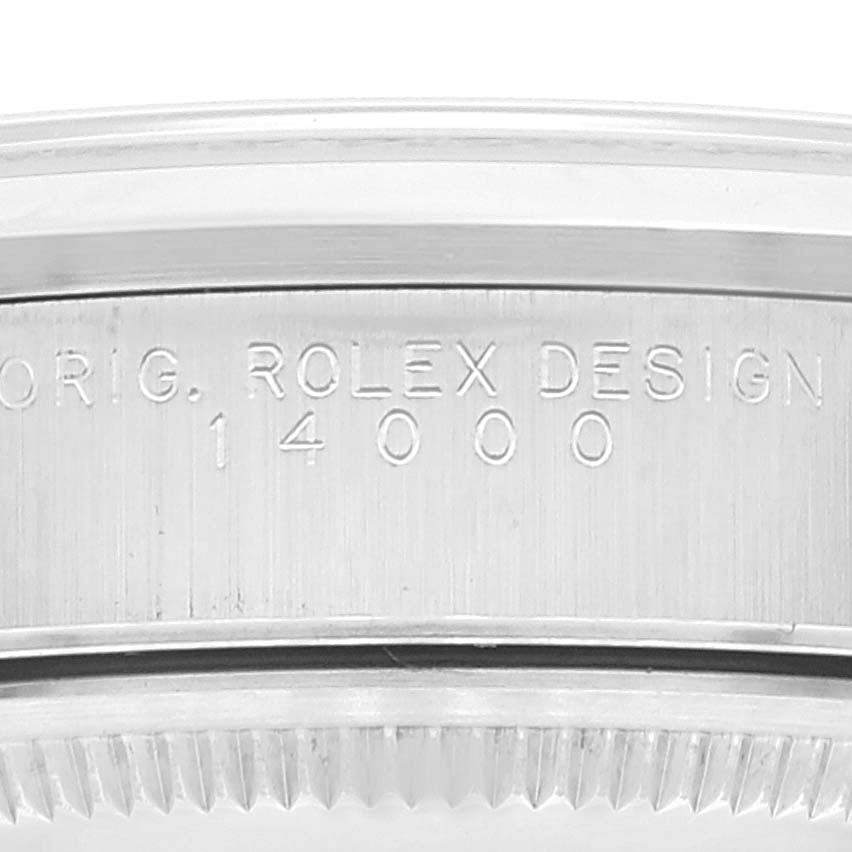 This image shows a close-up of the case back of a Rolex Air-King 14000 Men's Stainless Steel Blue Dial 14000 Men's Stainless Steel Blue Dial, revealing the engravings "ORIG. ROLEX DESIGN 14000."