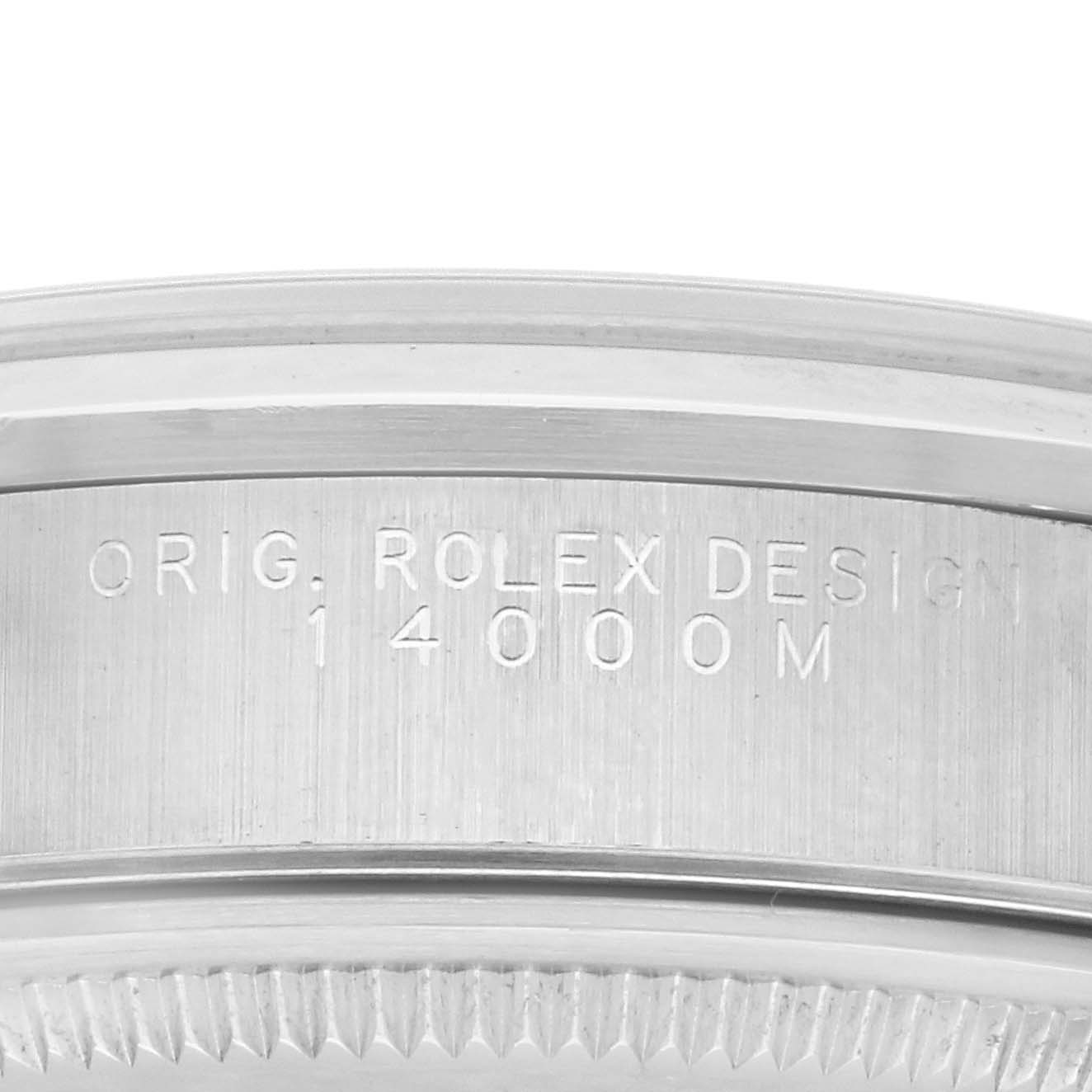 The image shows a close-up of the side detailing and engraving on the bezel of the Rolex Air-King 14000M Men's Stainless Steel Blue Dial 14000M Men's Stainless Steel Blue Dial watch.
