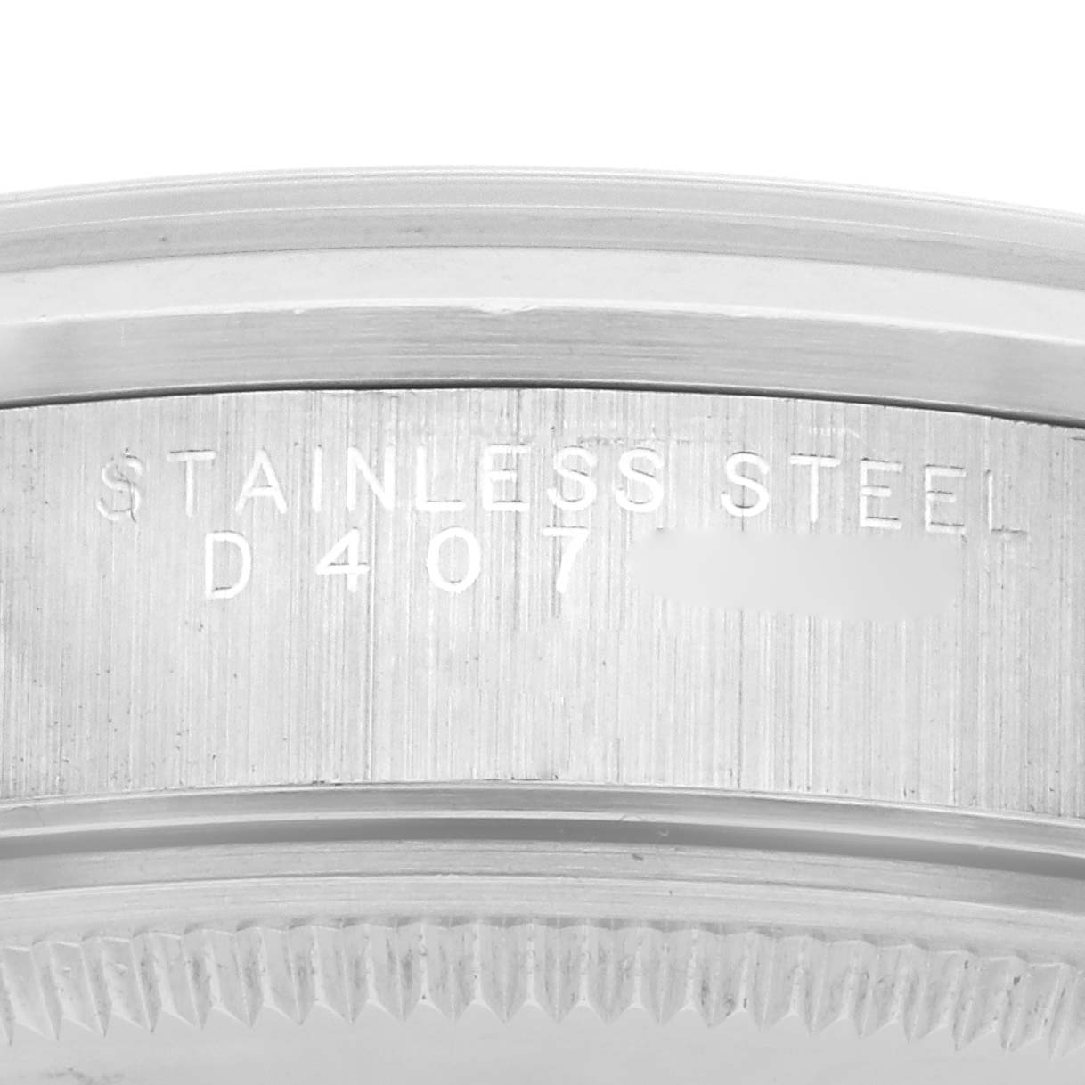 The image shows a close-up of the side of a Rolex Air-King 14000M Men's Stainless Steel Blue Dial 14000M Men's Stainless Steel Blue Dial watch, highlighting the stainless steel engraving.