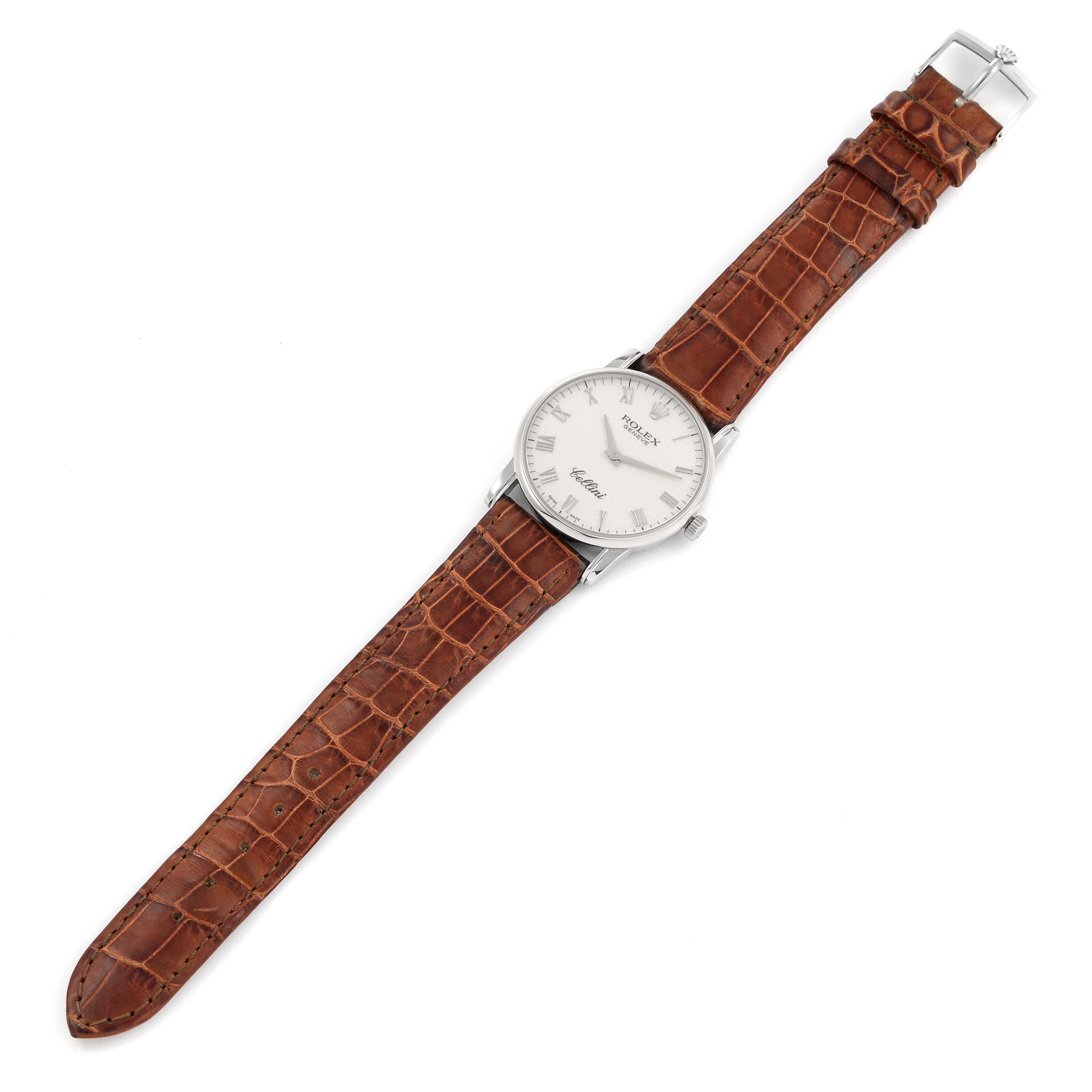 The image shows a Rolex Cellini 5116 Men's White Gold Beige Dial 5116 Men's White Gold Beige Dial watch angled diagonally, displaying its face, leather strap, and clasp.