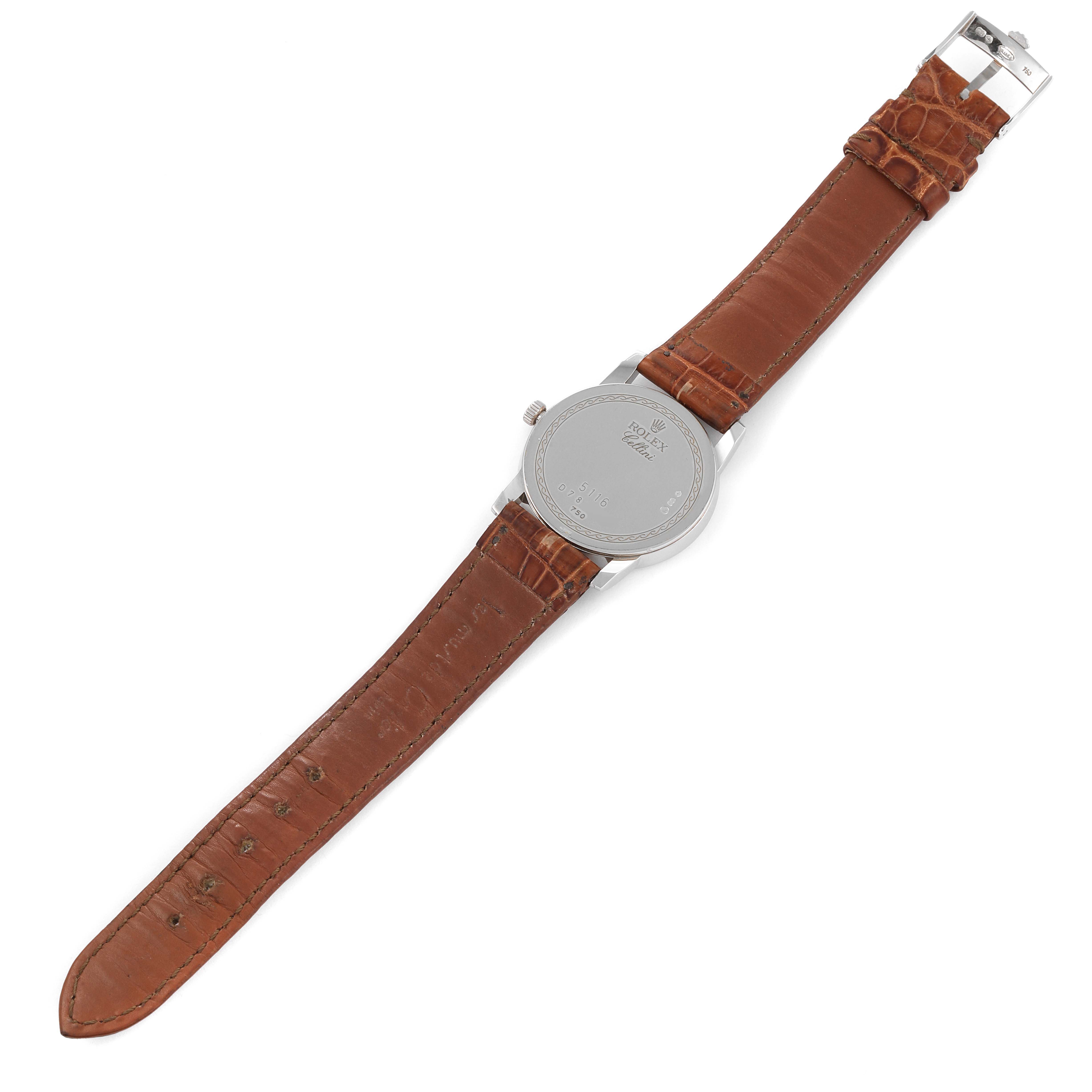 The image shows a top-down view of the back of a Rolex Cellini 5116 Men's White Gold Beige Dial 5116 Men's White Gold Beige Dial watch with a brown leather strap.