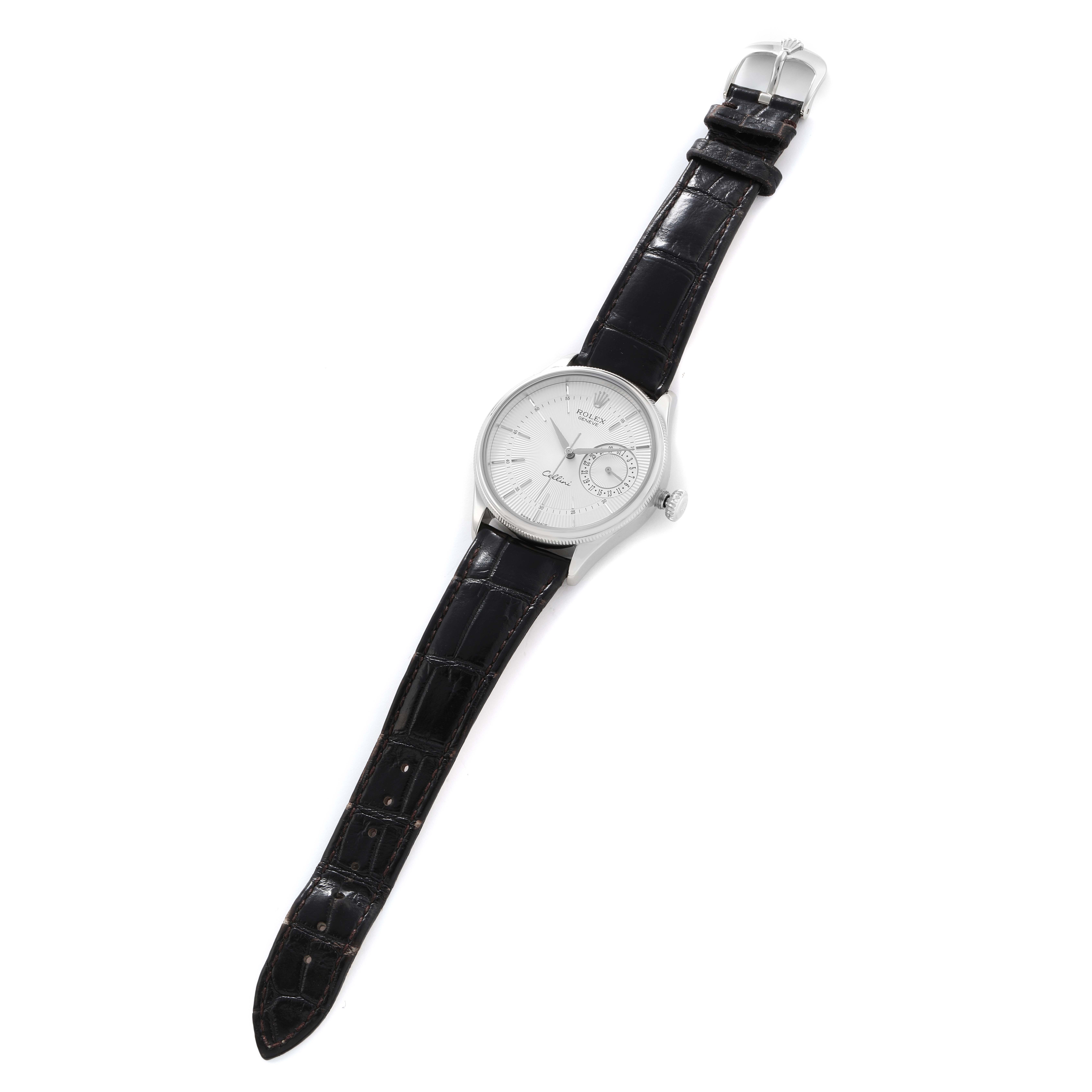 The Rolex Cellini 50519 Men
s White Gold Silver Dial watch is shown from a top-down angle, displaying its entire face, case, and black leather strap with a buckle.