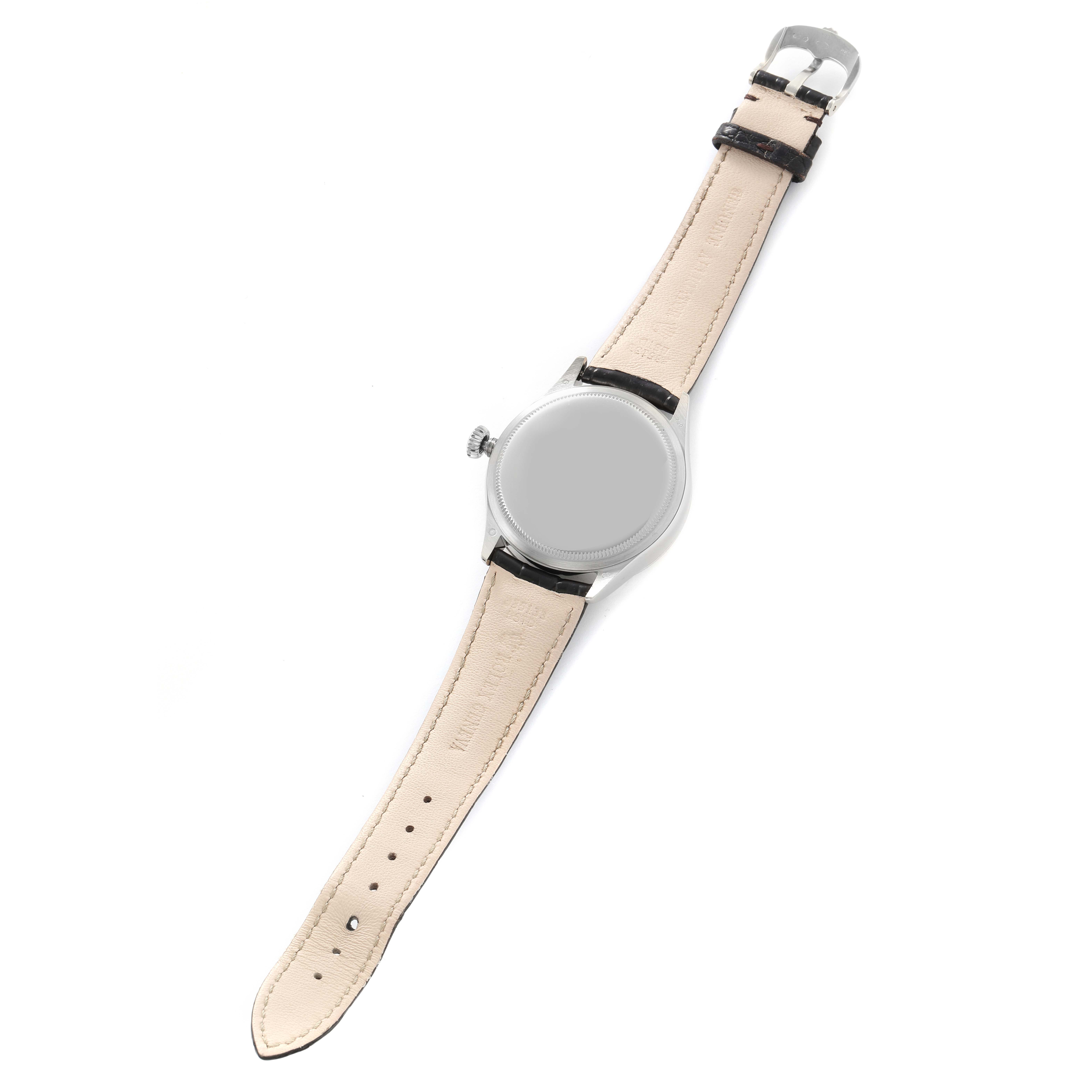 The Rolex Cellini 50519 Men
s White Gold Silver Dial watch is shown from the back, highlighting the strap, buckle, and case back.