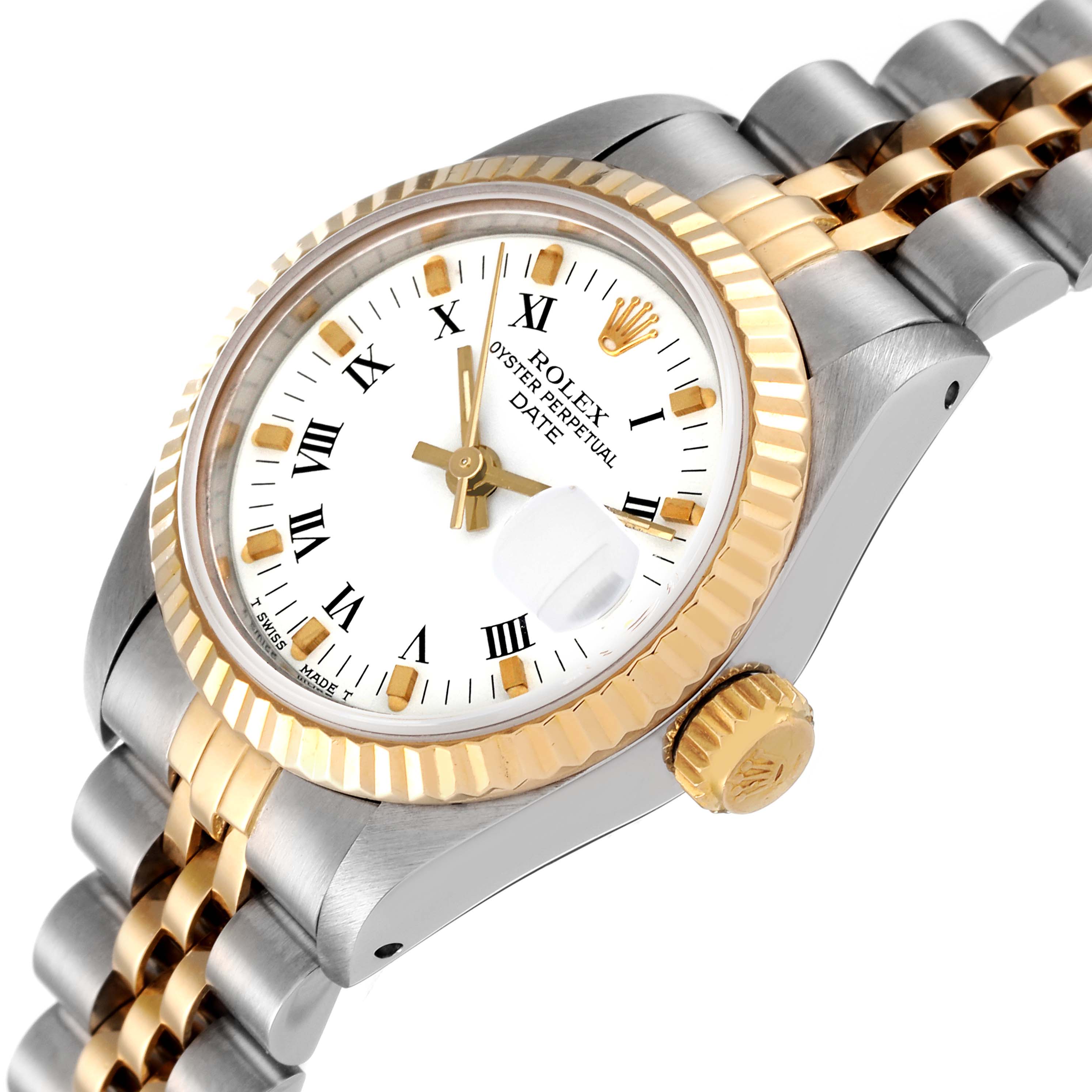 This image shows a Rolex Date 69173 Women
s Steel and Gold (two tone) White Dial 69173 Women
s Steel and Gold (two tone) White Dial model watch from an angled perspective, displaying the crown, bezel, dial, bracelet, and date magnifier.