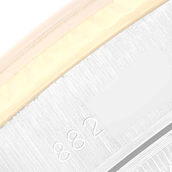 This image shows a close-up of the case edge and serial numbers of the Rolex Date 69173 Women's Steel and Gold (two tone) White Dial 69173 Women's Steel and Gold (two tone) White Dial model watch.