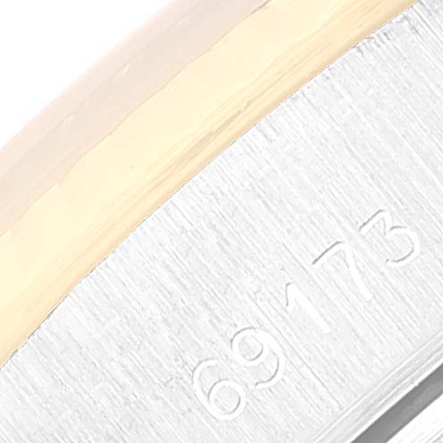 This image shows a close-up of the serial number "69173" on the case of a Rolex Date 69173 Women's Steel and Gold (two tone) White Dial 69173 Women's Steel and Gold (two tone) White Dial model watch.