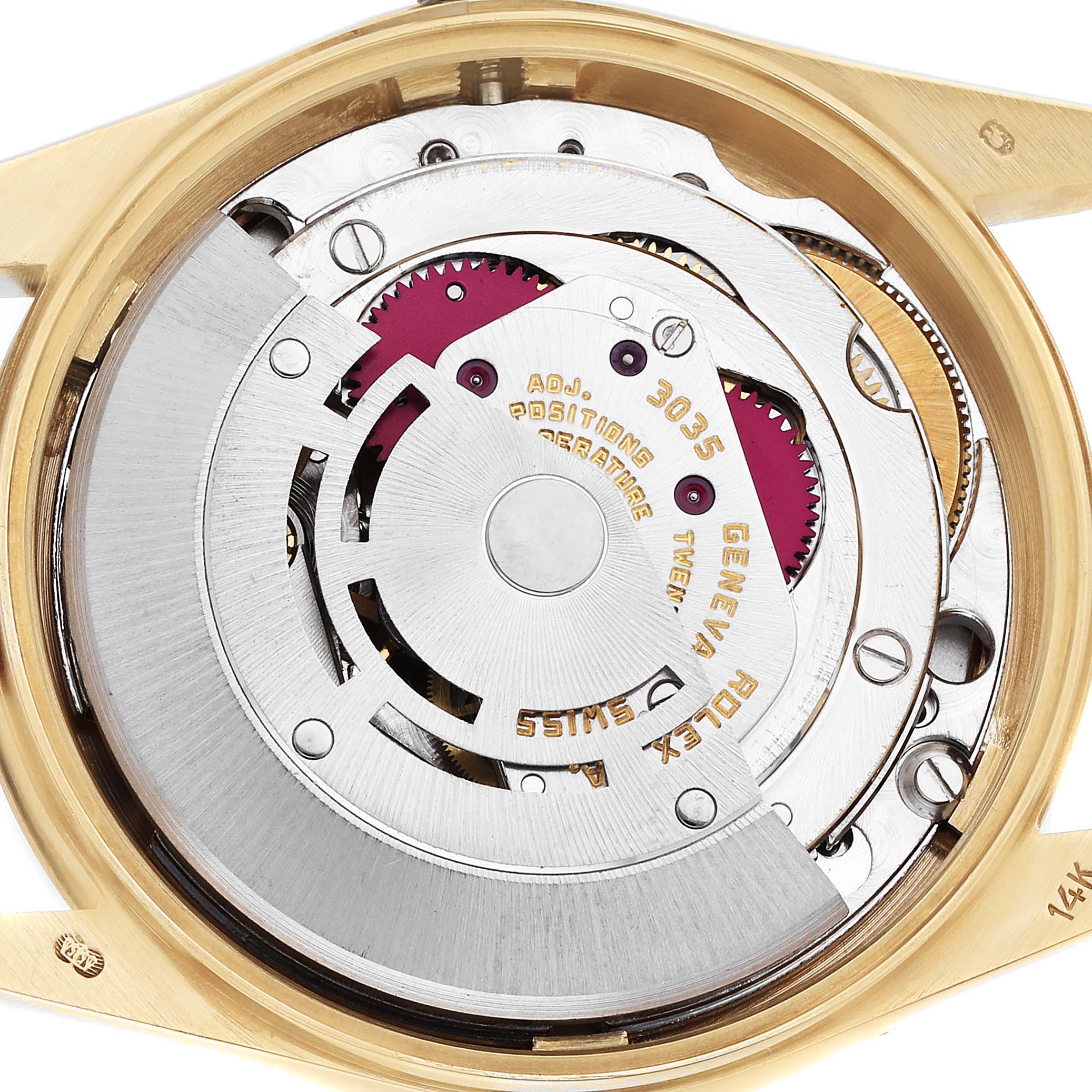 The image shows the movement of a Rolex Date 15037 Men
s Yellow Gold Champagne Dial model watch, focusing on its mechanical components from a top-down angle.