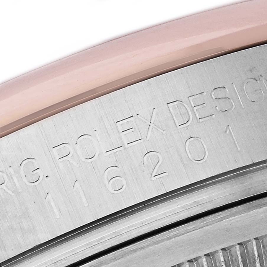 The image shows a close-up of the side engraving on a Rolex Datejust 116201 Men's Steel and Gold (two tone) Pink Dial 116201 Men's Steel and Gold (two tone) Pink Dial model, highlighting the design and model numbers.