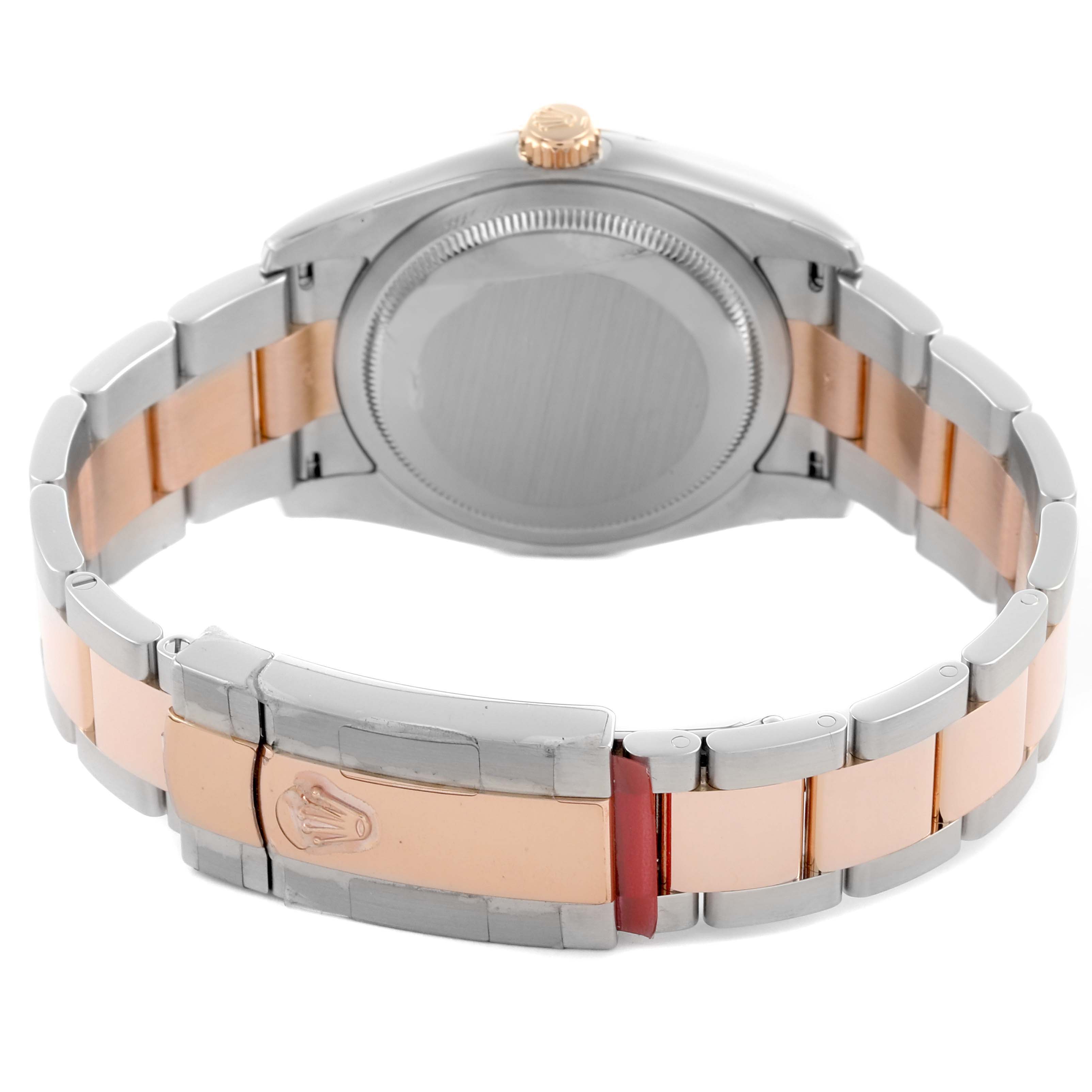 The image shows the back and bracelet clasp of a Rolex Datejust 116201 Men's Steel and Gold (two tone) Pink Dial 116201 Men's Steel and Gold (two tone) Pink Dial watch, highlighting its two-tone metal design.