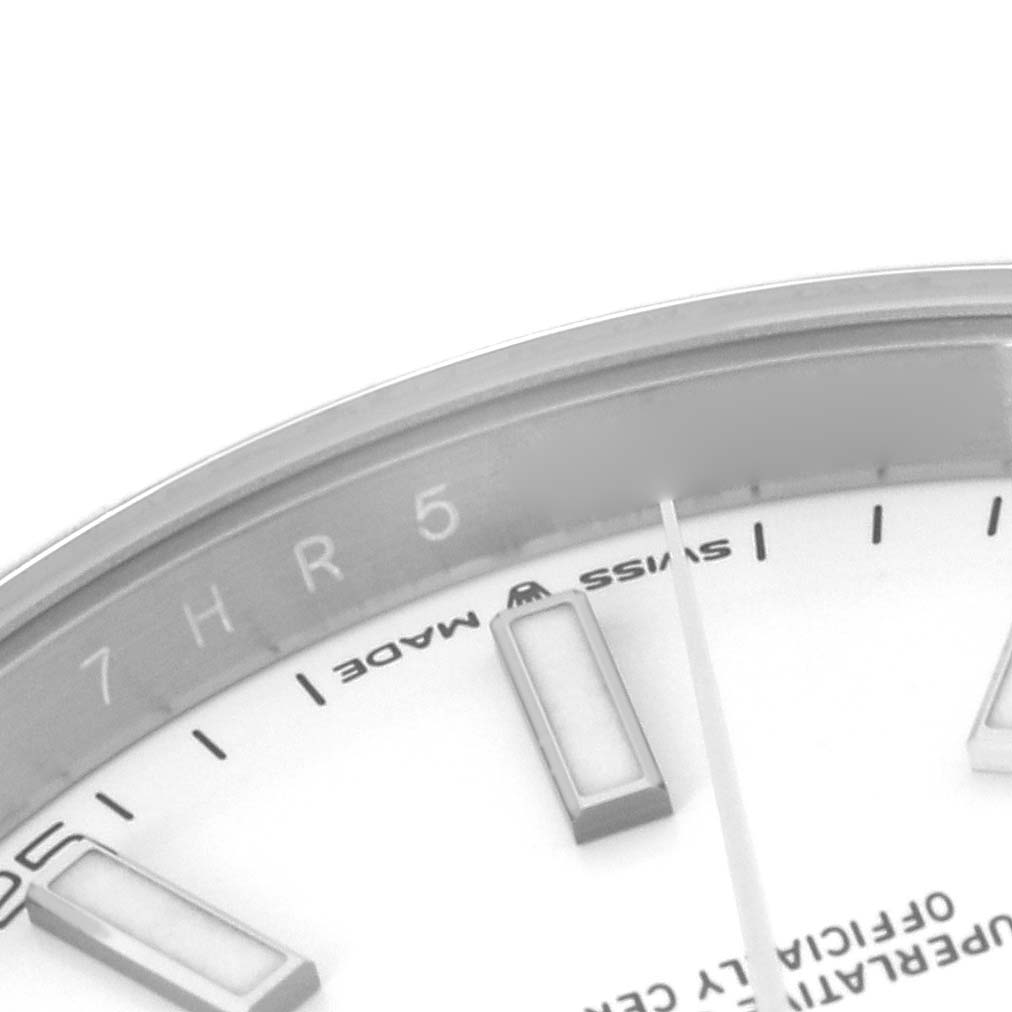 The image shows a close-up of the upper part of the dial and hour markers of a Rolex Datejust 41 126300 Men's Stainless Steel White Dial 126300 Men's Stainless Steel White Dial watch.