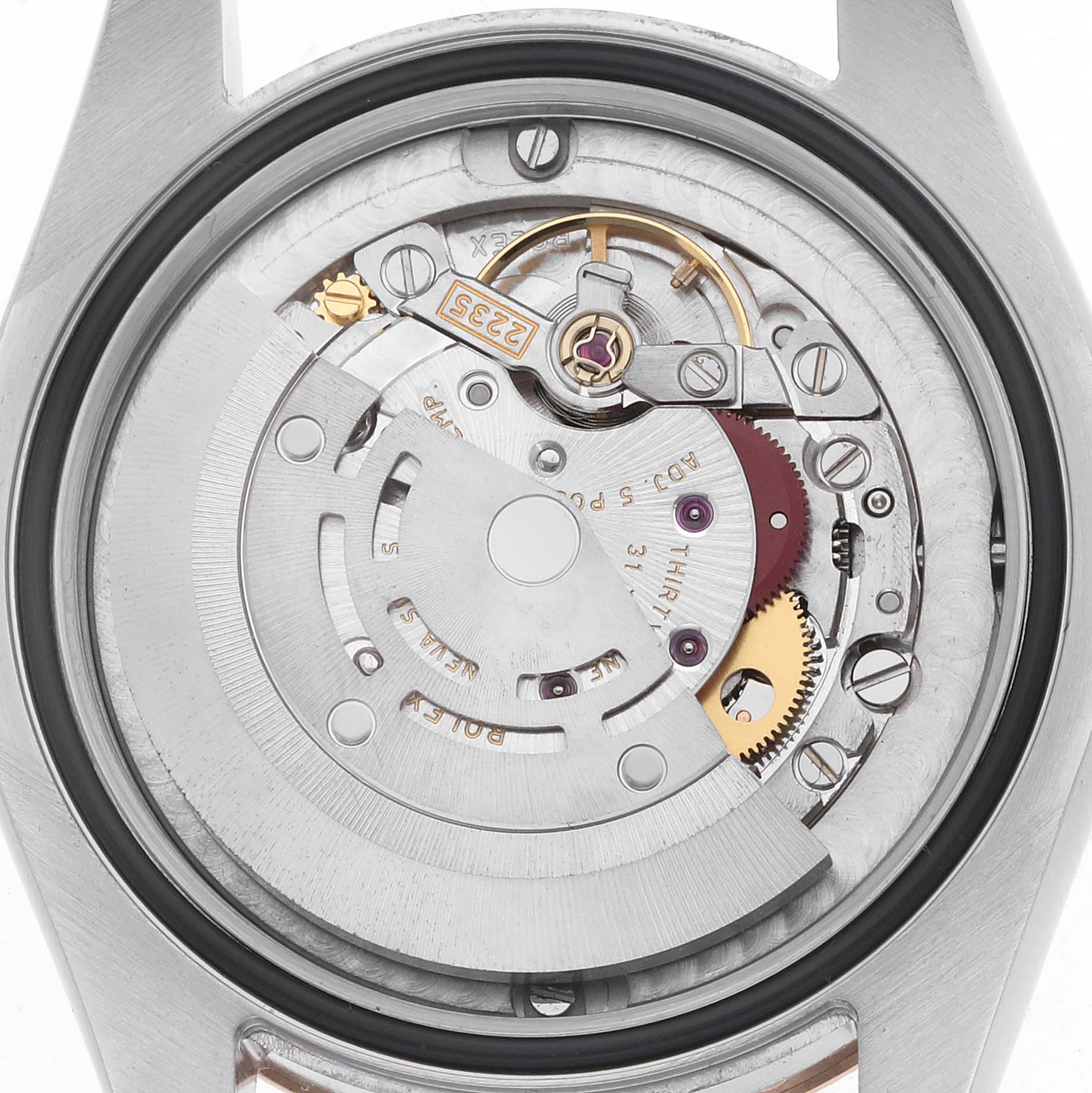 The image shows the back view of a Rolex Mid-Size 178241 Women
s Steel and Gold (two tone) Pink Dial watch displaying its internal mechanical movement.